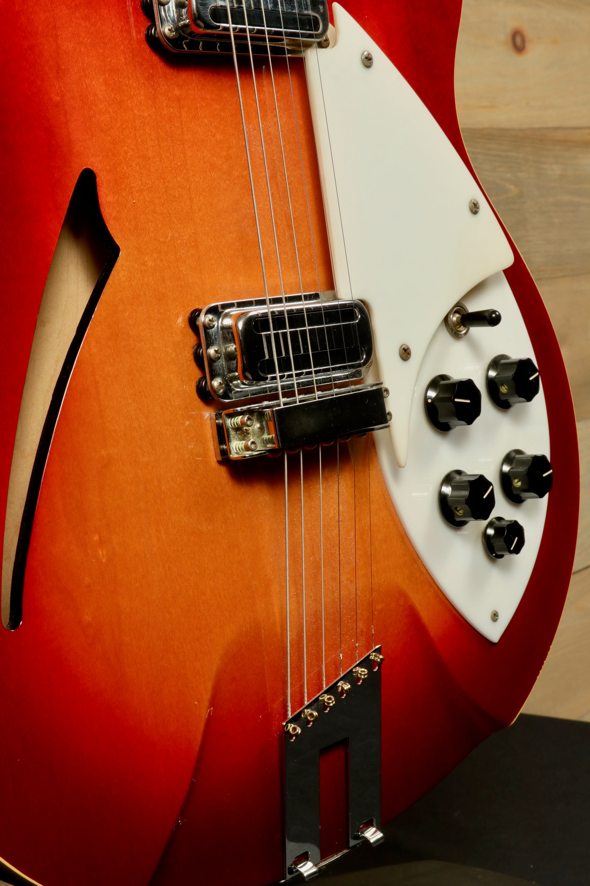Rickenbacker 360 hollow body electric guitar, sunburst finish, close-up view of body and controls