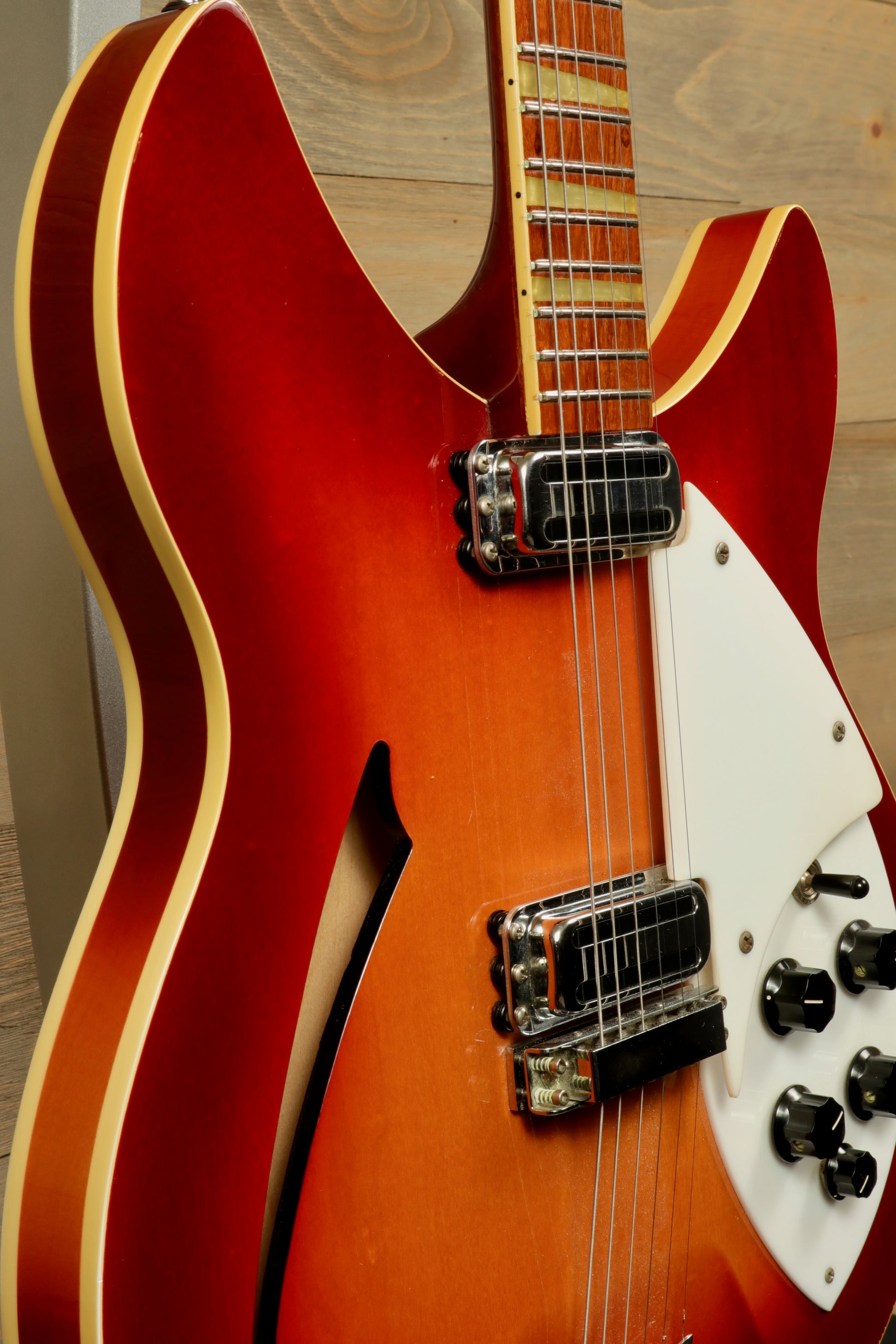 Rickenbacker 360 hollow body electric guitar in fireglo finish, side view showcasing classic design