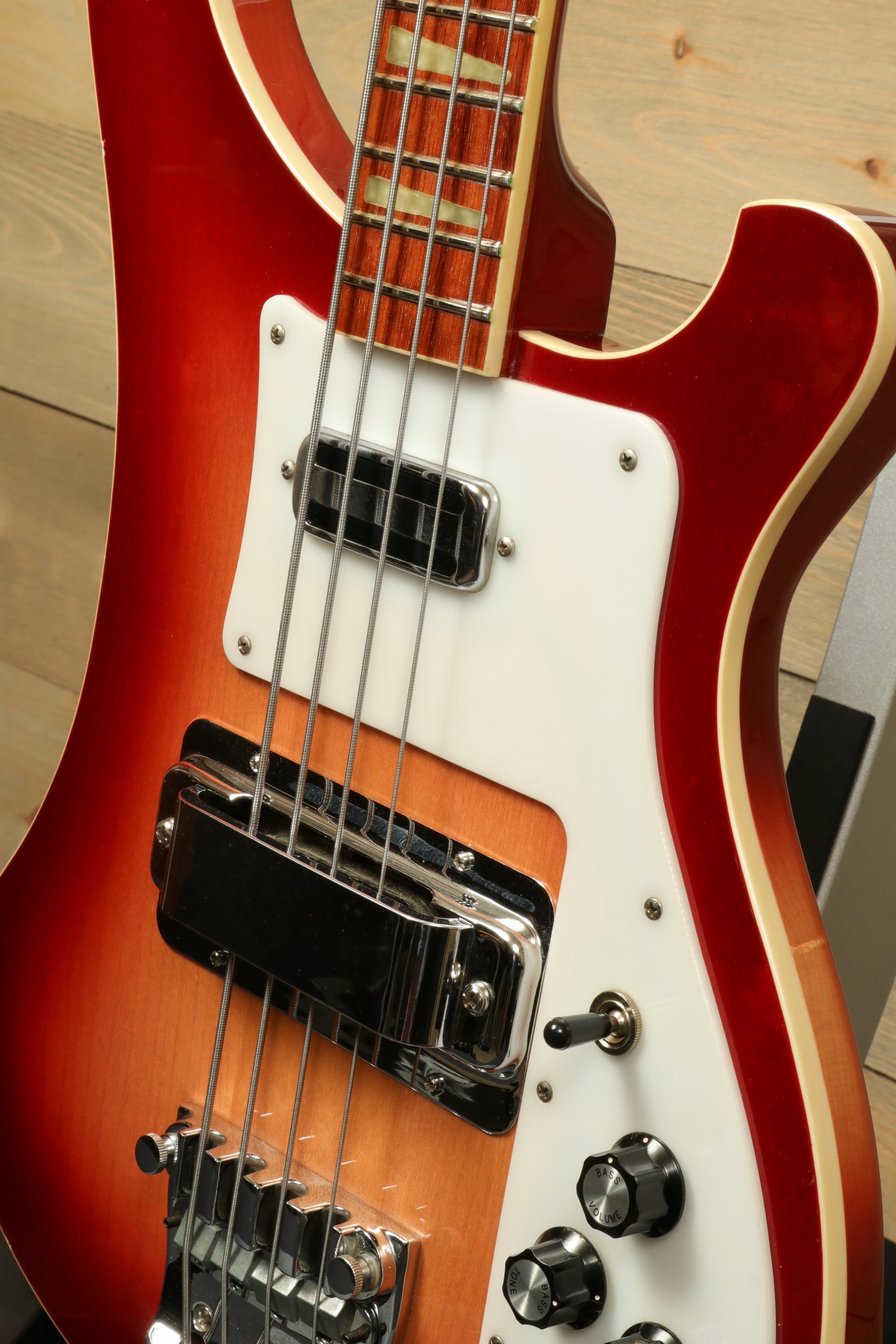 Rickenbacker 4001 bass guitar in cherry red, close-up view showcasing body and pickups
