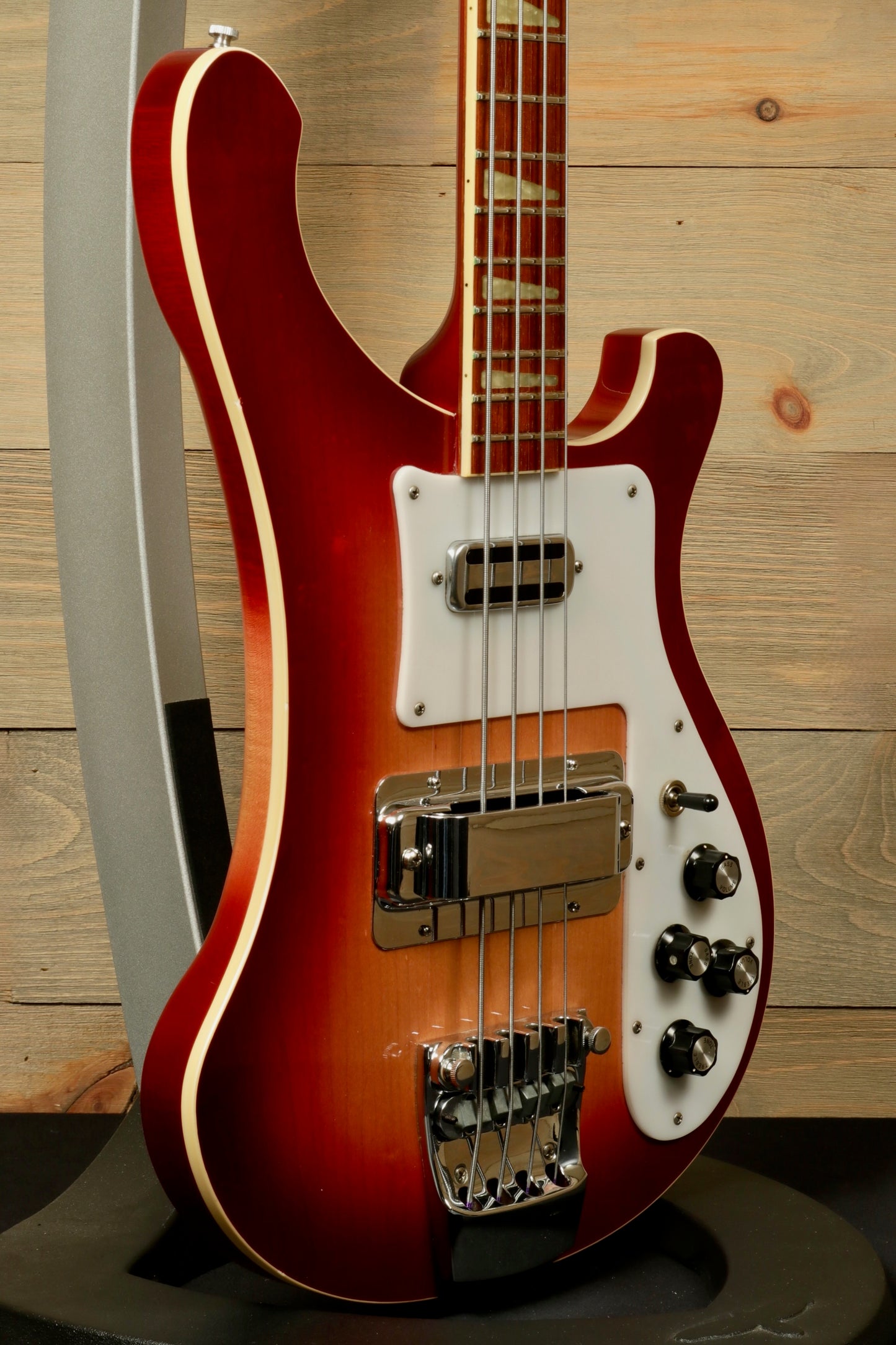 Rickenbacker 4001 bass guitars in vintage sunburst finish, side view showcasing stylish curves