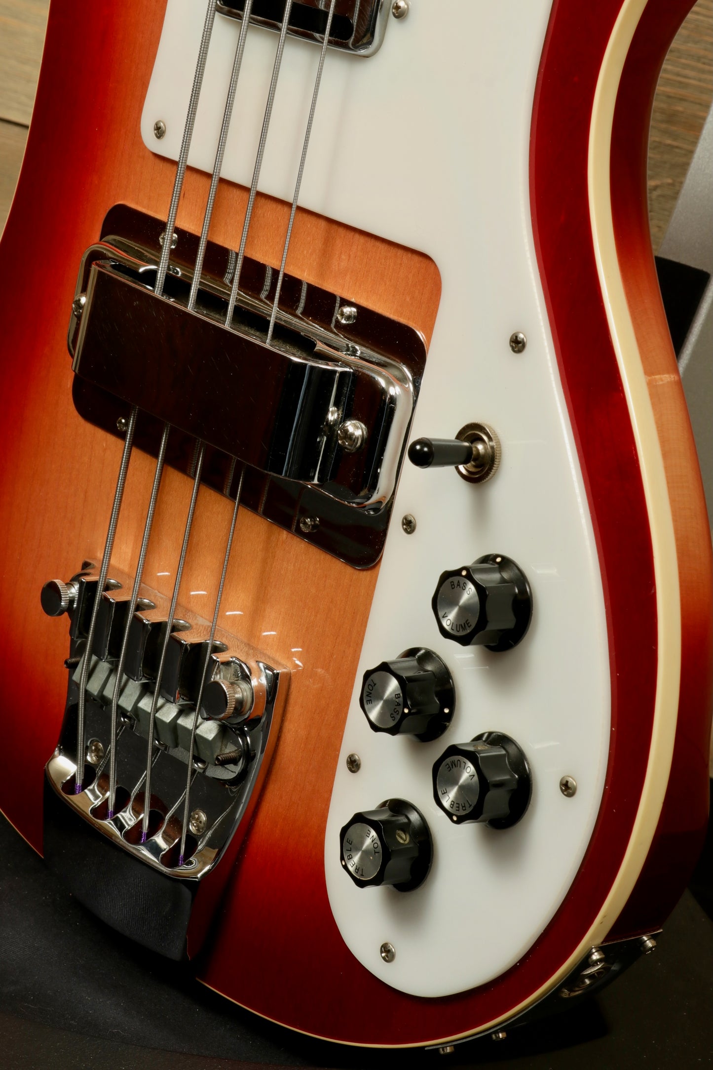 Rickenbacker 4001 bass guitars in sunburst finish, close-up view of body and controls