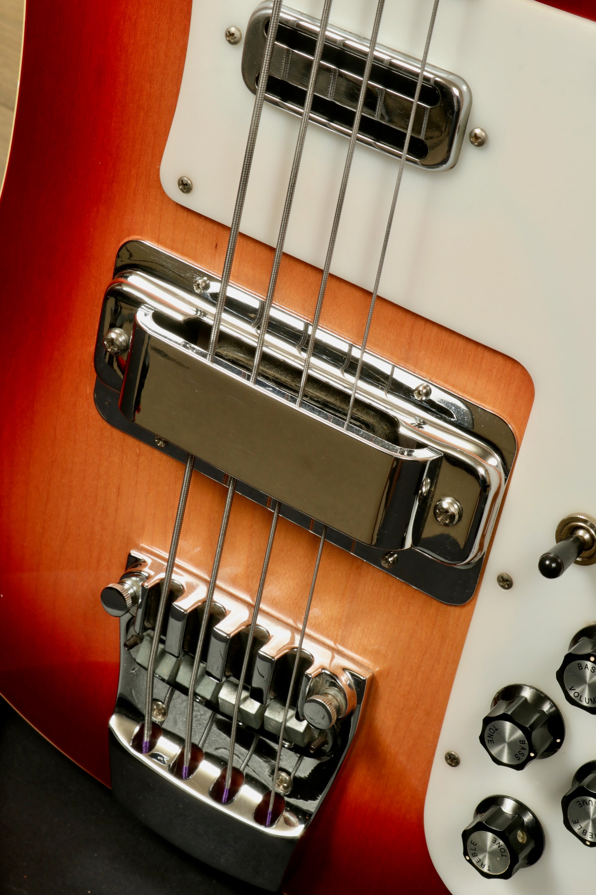 Rickenbacker 4001 bass guitars, sunburst finish, close-up view of bridge and pickups