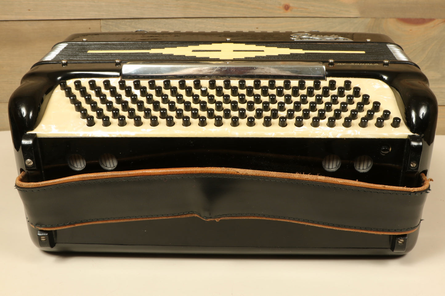 Rivoli Little Maestro Accordion in black and cream, front view showcasing buttons and design