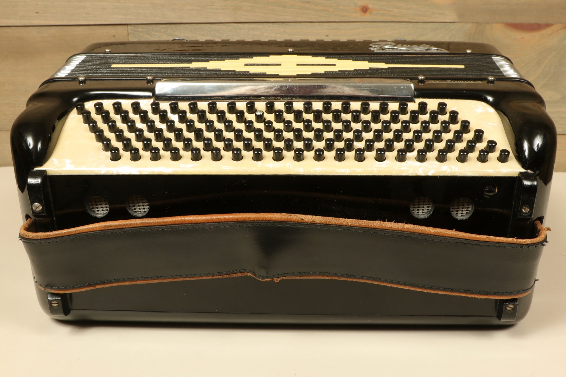 Rivoli Little Maestro Accordion in black and cream, front view showcasing buttons and design