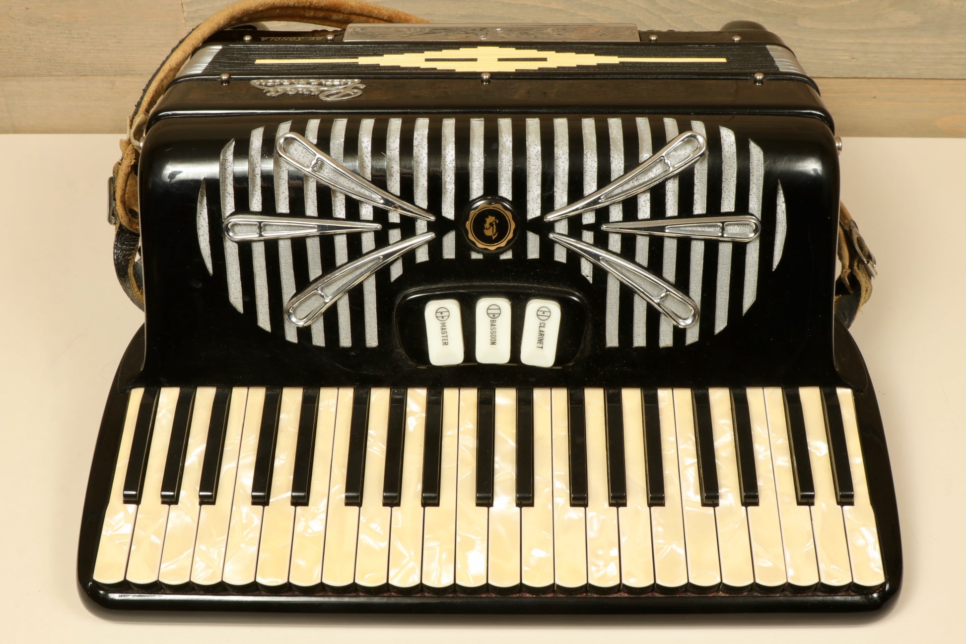 Rivoli Little Maestro Accordion in black and white, front view with keys and buttons