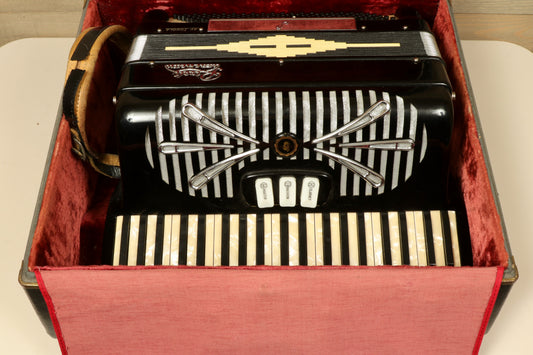 Rivoli Little Maestro Accordion in black with silver keys, top view in red velvet case