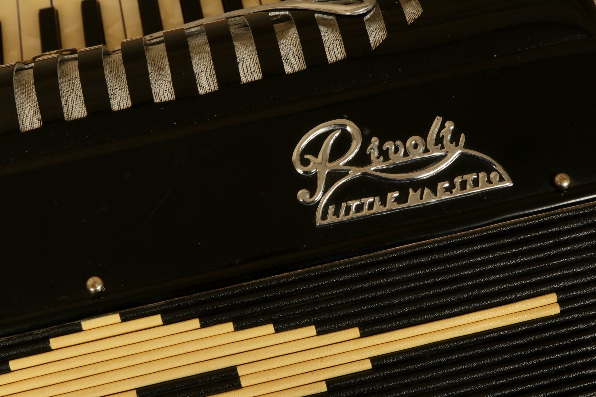 Rivoli Little Maestro Accordion in black with keys and decorative design, close-up view
