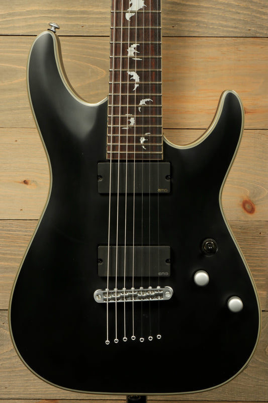 Used Schecter Damien 7 Platinum guitar with black finish and sleek design for versatile musicians