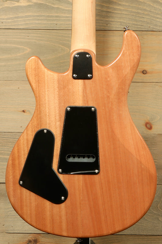PRS electric guitar, natural wood finish, back view showcasing the body contours and pickup cavity
