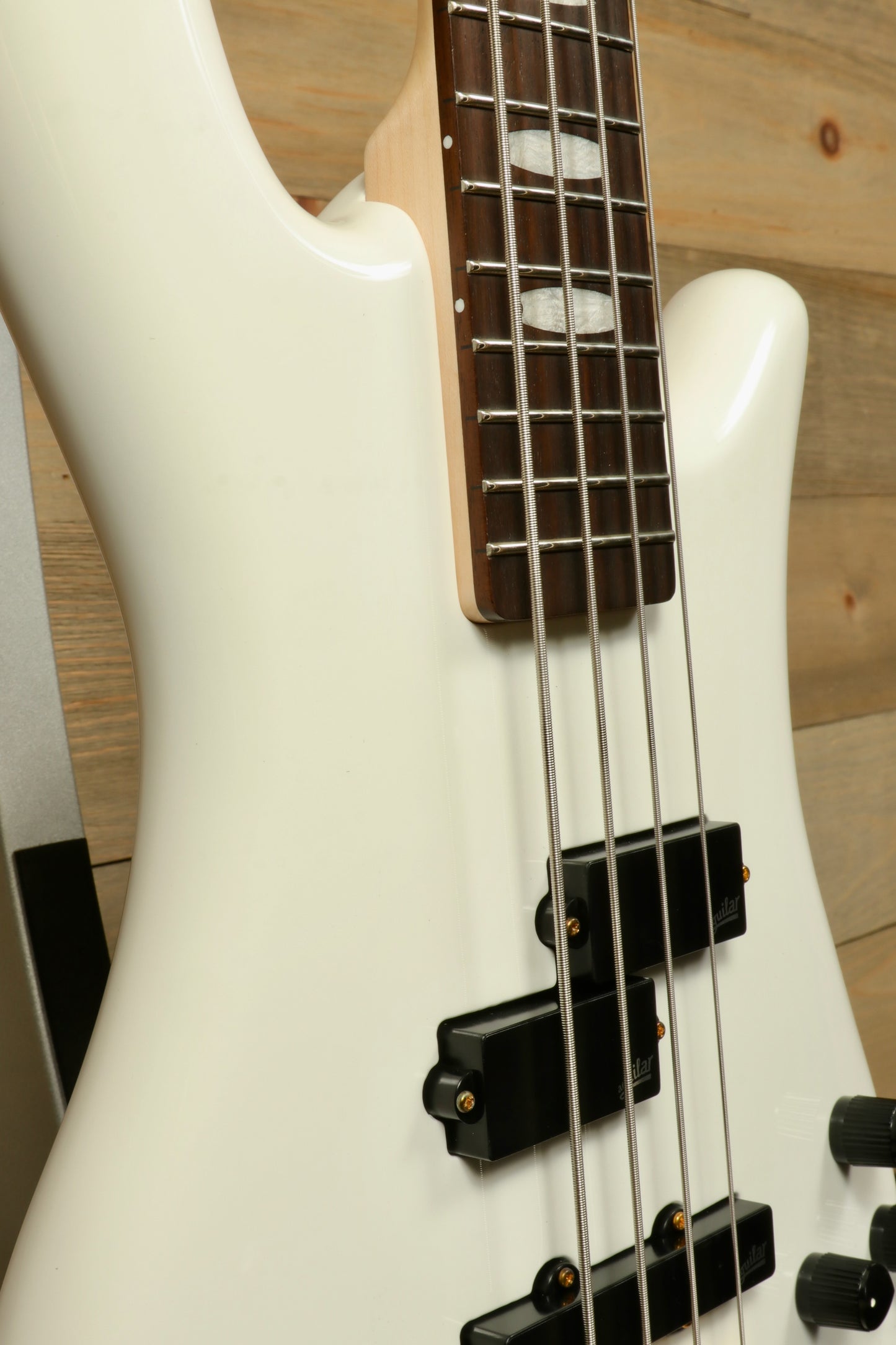 Close-up of Spector ICON NS-2 bass guitar in white finish with sleek design and quality craftsmanship