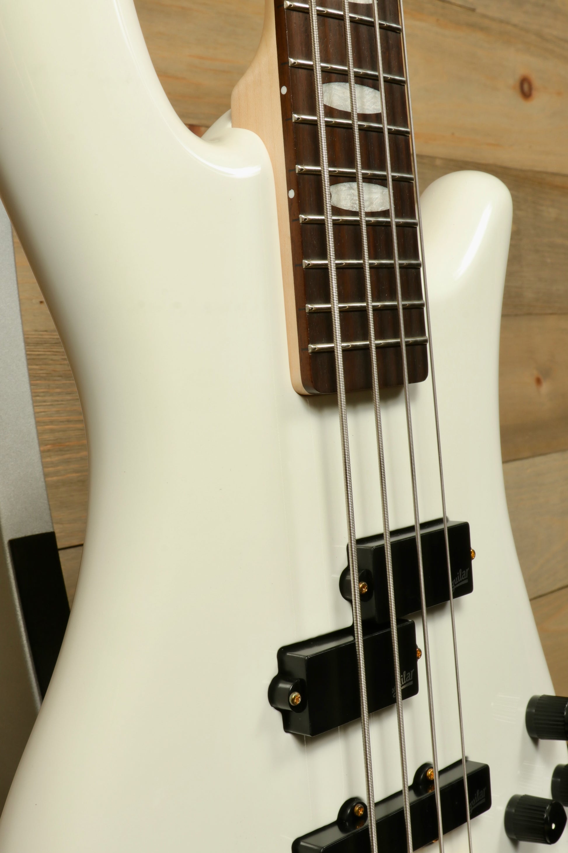 Close-up of Spector ICON NS-2 bass guitar in white finish with sleek design and quality craftsmanship