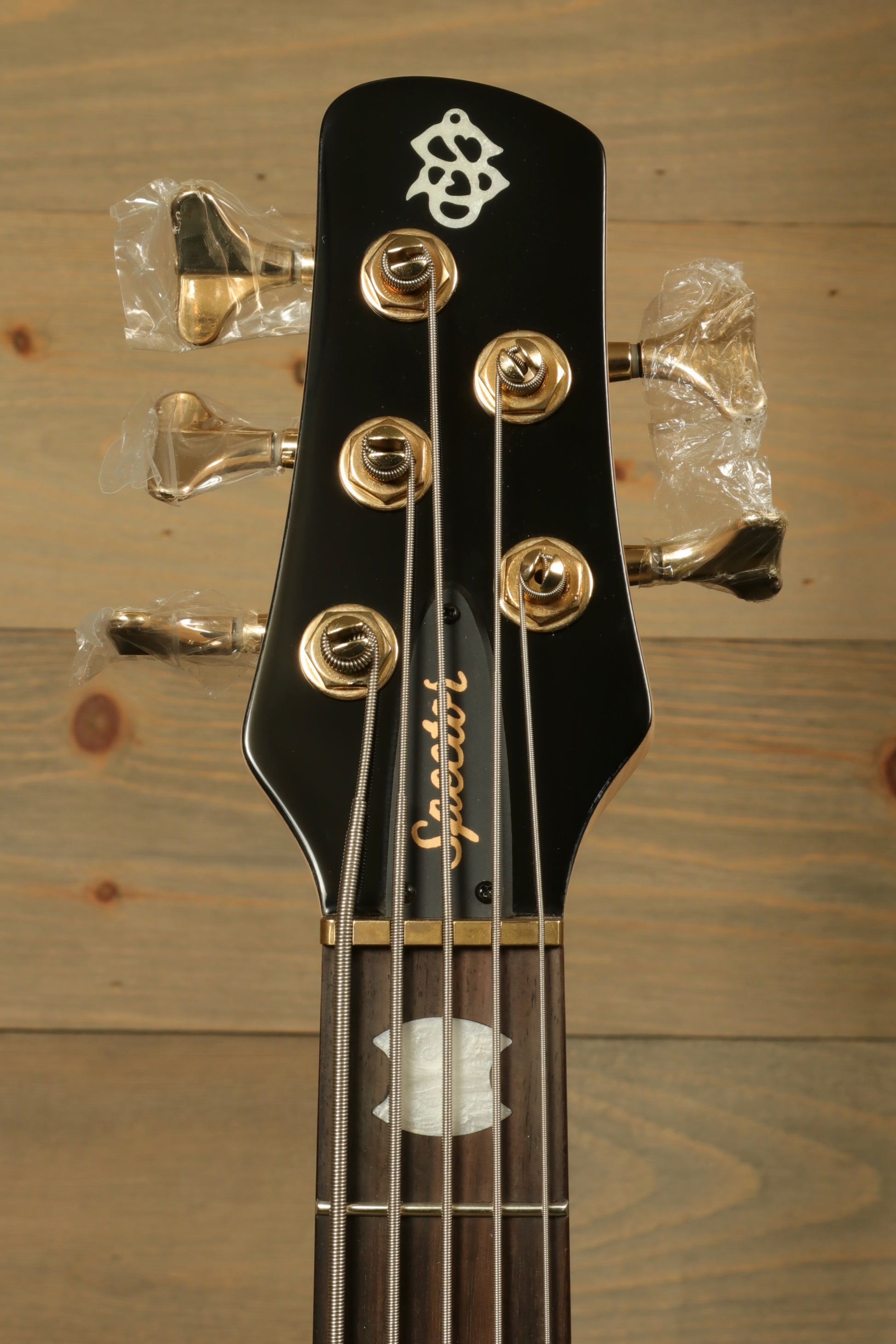 Spector Icon NS-5 5-string Electric Bass Guitar - Black Stain Gloss, headstock view with gold tuning pegs