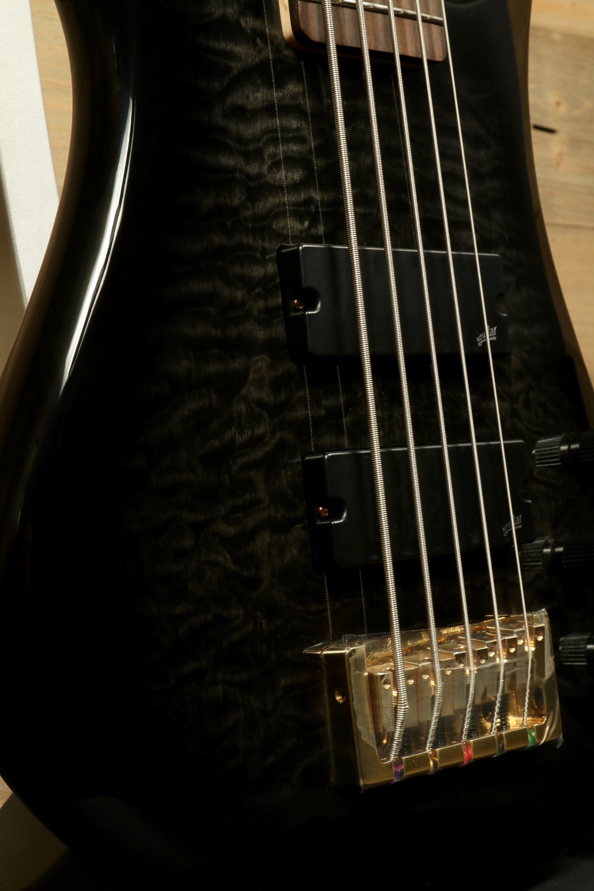 Spector Icon NS-5 5-string Electric Bass Guitar in Black Stain Gloss, side view showing pickups and body finish
