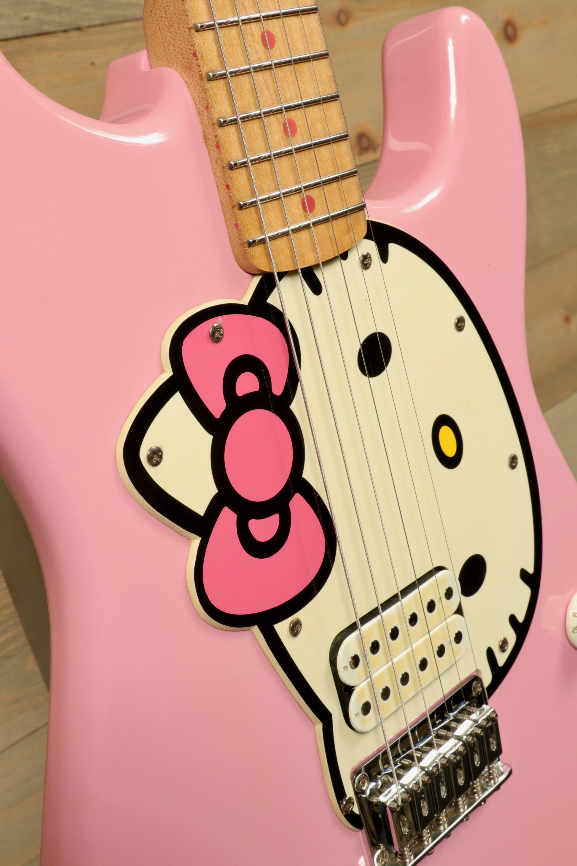 2006 Squier Hello Kitty Stratocaster electric guitar in pink, front view with signature Hello Kitty design