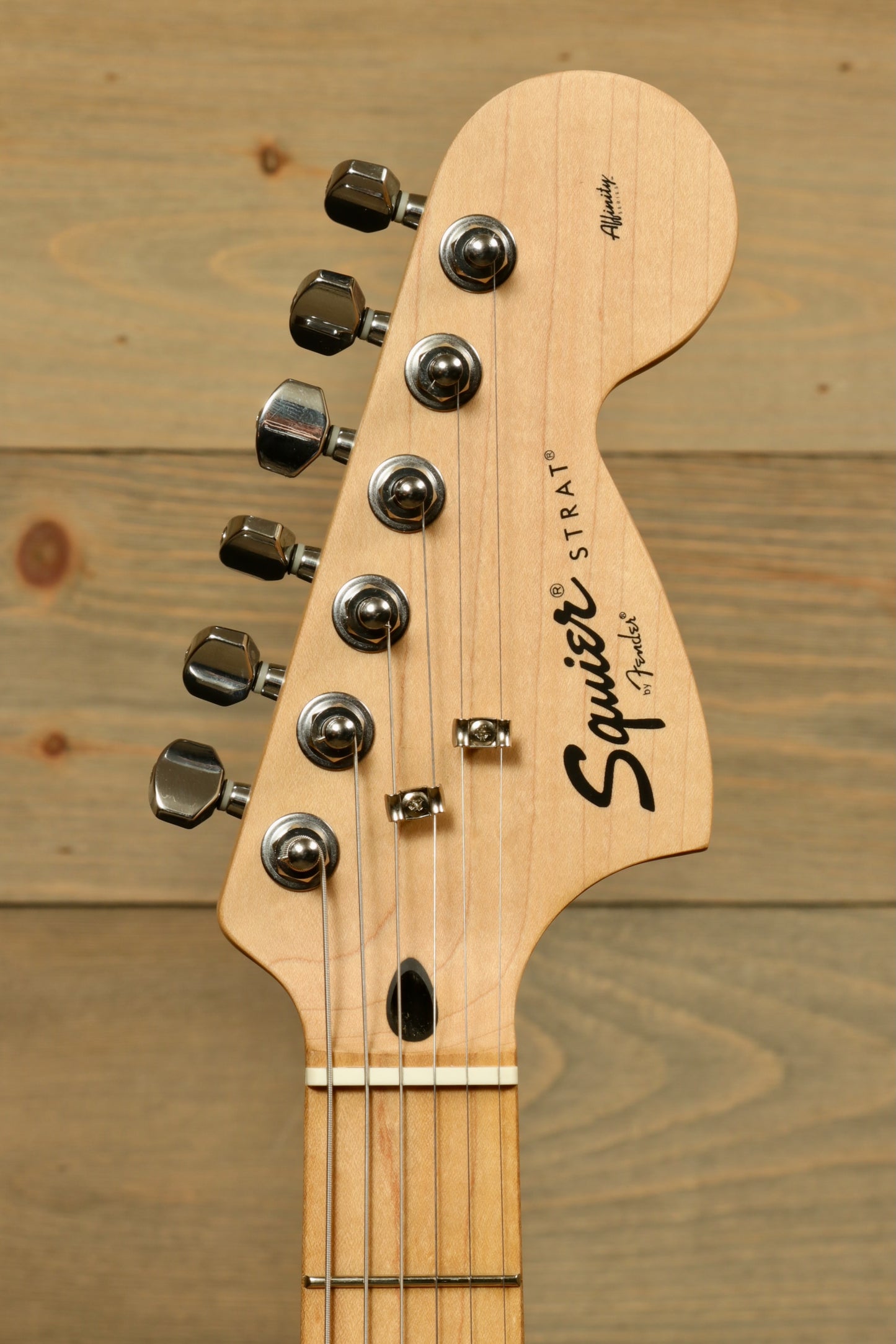 Squier 2006 Squier Hello Kitty Stratocaster, headstock view with chrome tuners and maple finish