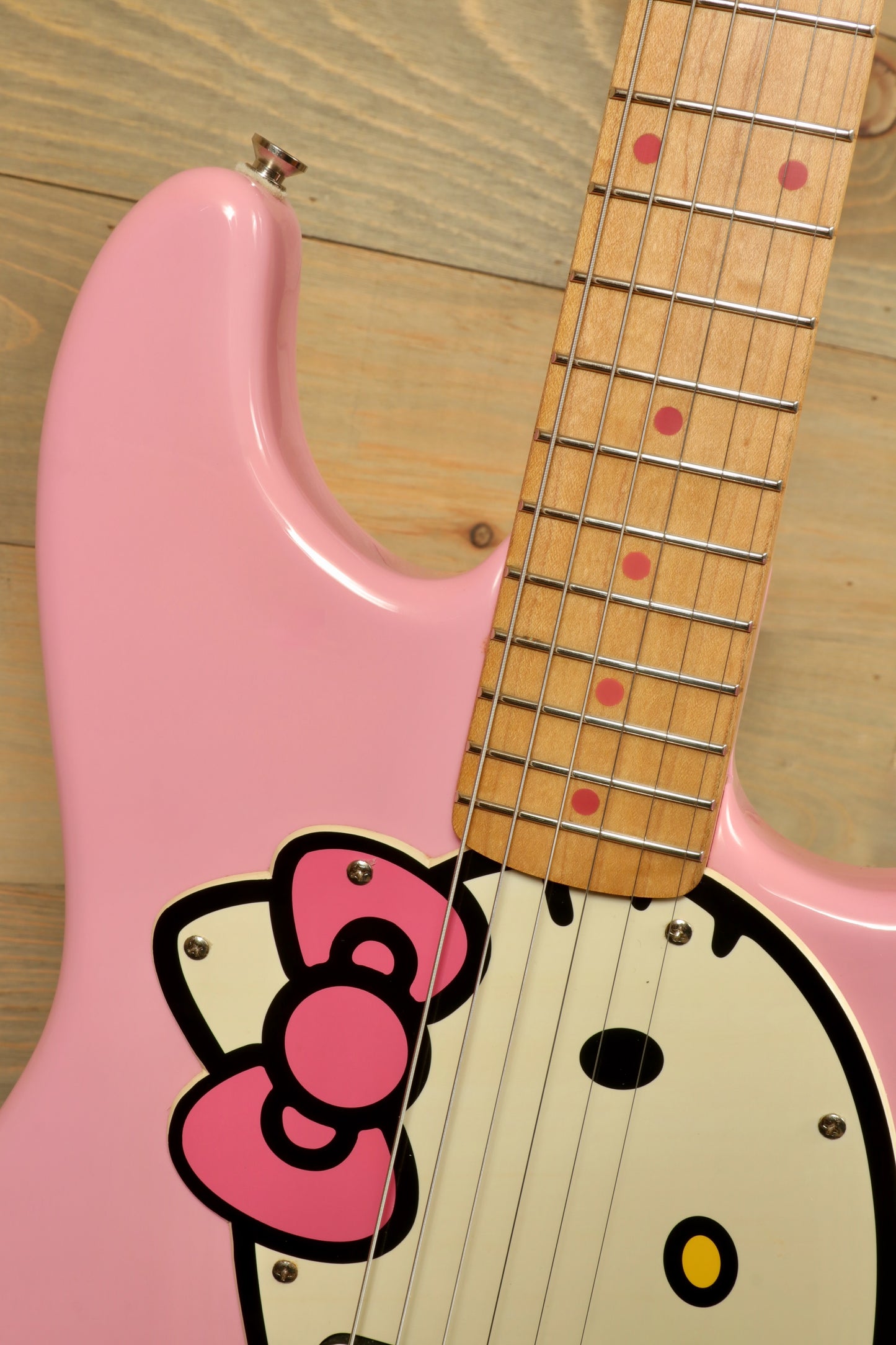 2006 Squier Hello Kitty Stratocaster in pink with decorative Hello Kitty design, front view
