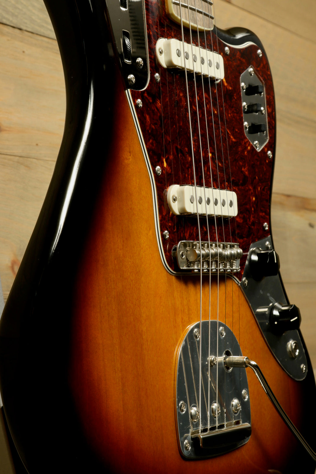 Squier Classic Vibe 70s Jaguar in sunburst finish, side view showcasing its elegant design
