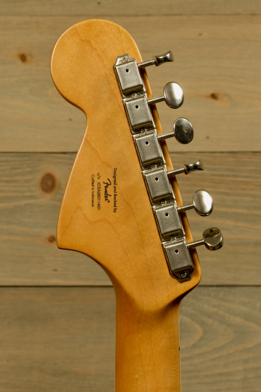 Squier Classic Vibe 70s Jaguar, natural wood finish, back view of headstock