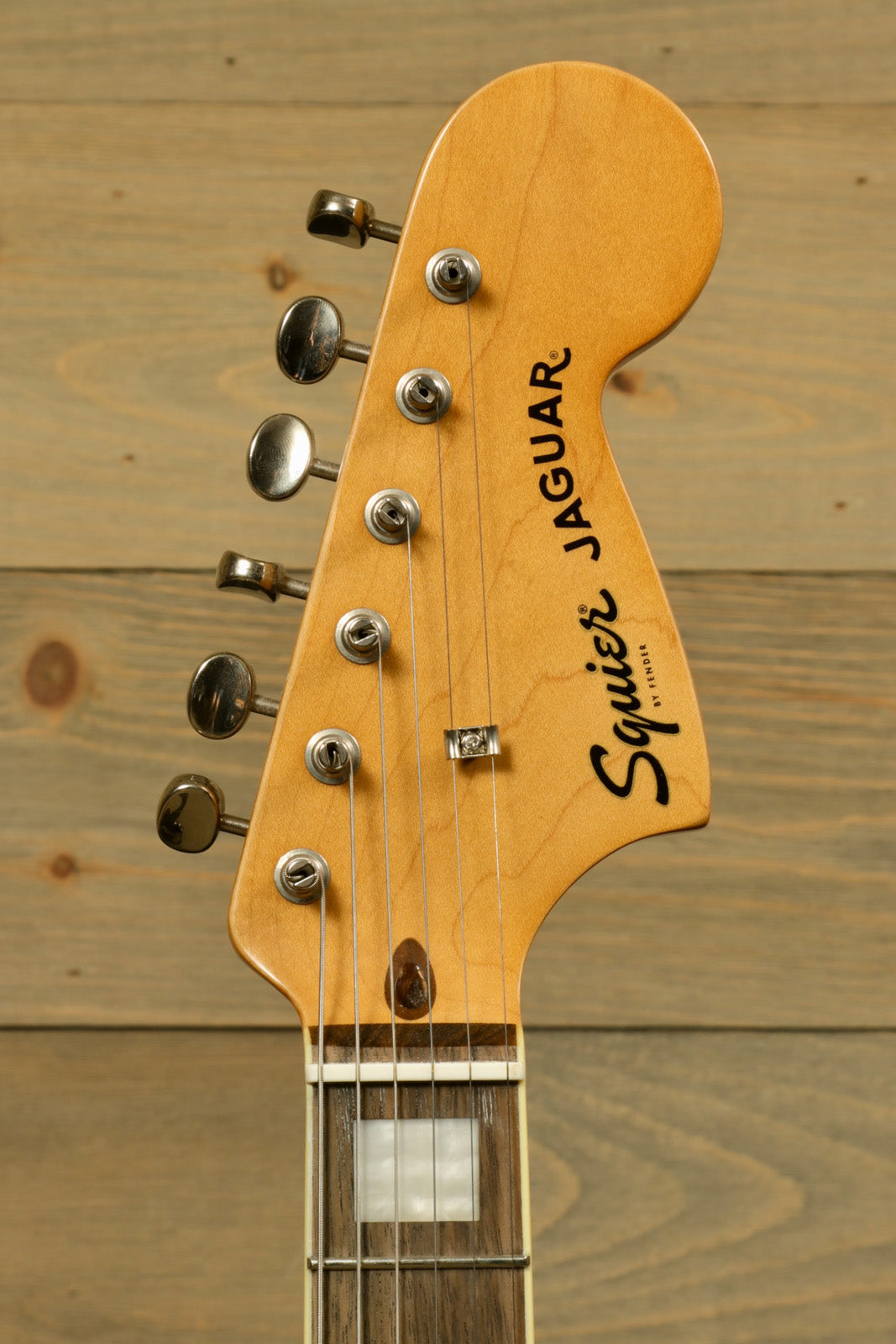 Squier Classic Vibe 70s Jaguar electric guitar, natural finish, headstock view