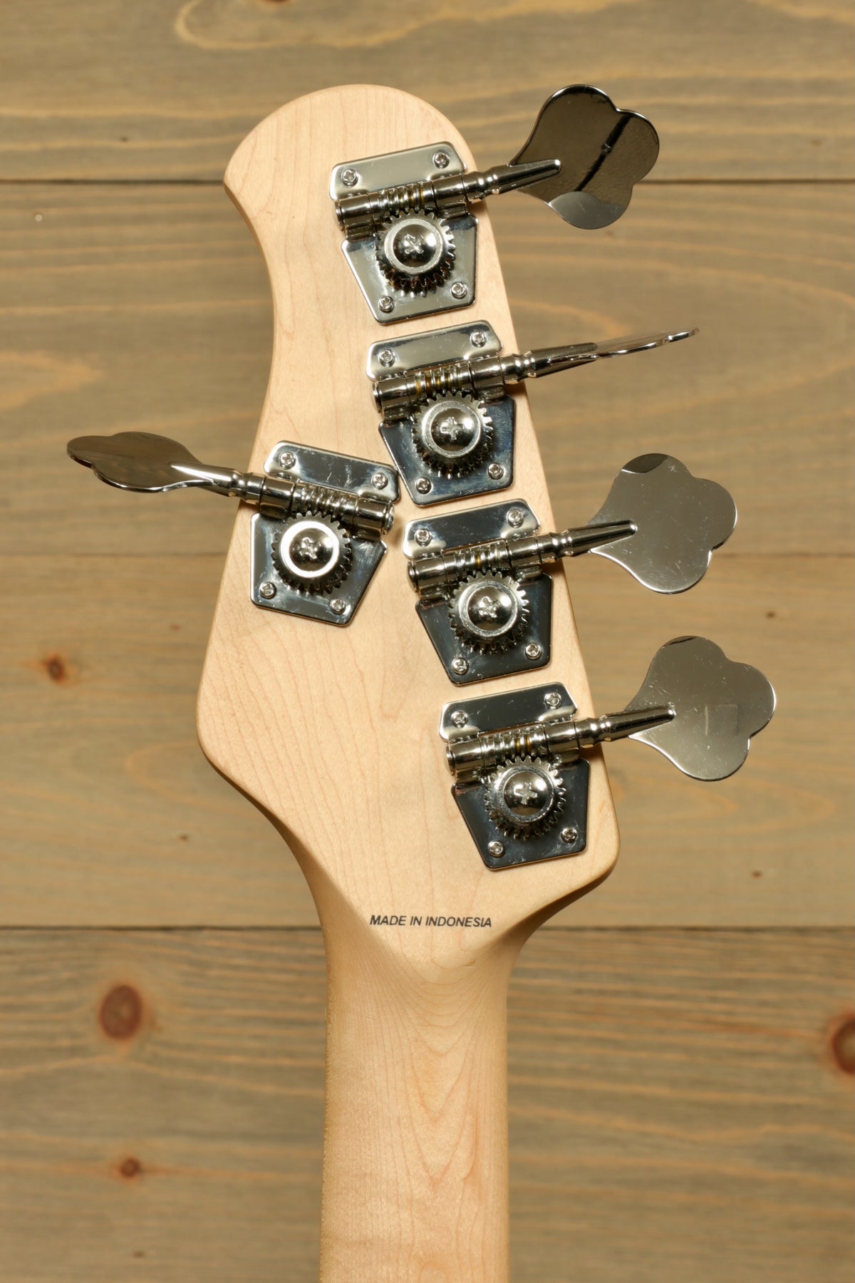 Sterling by Music Man used active 5 string bass headstock showing chrome tuning pegs