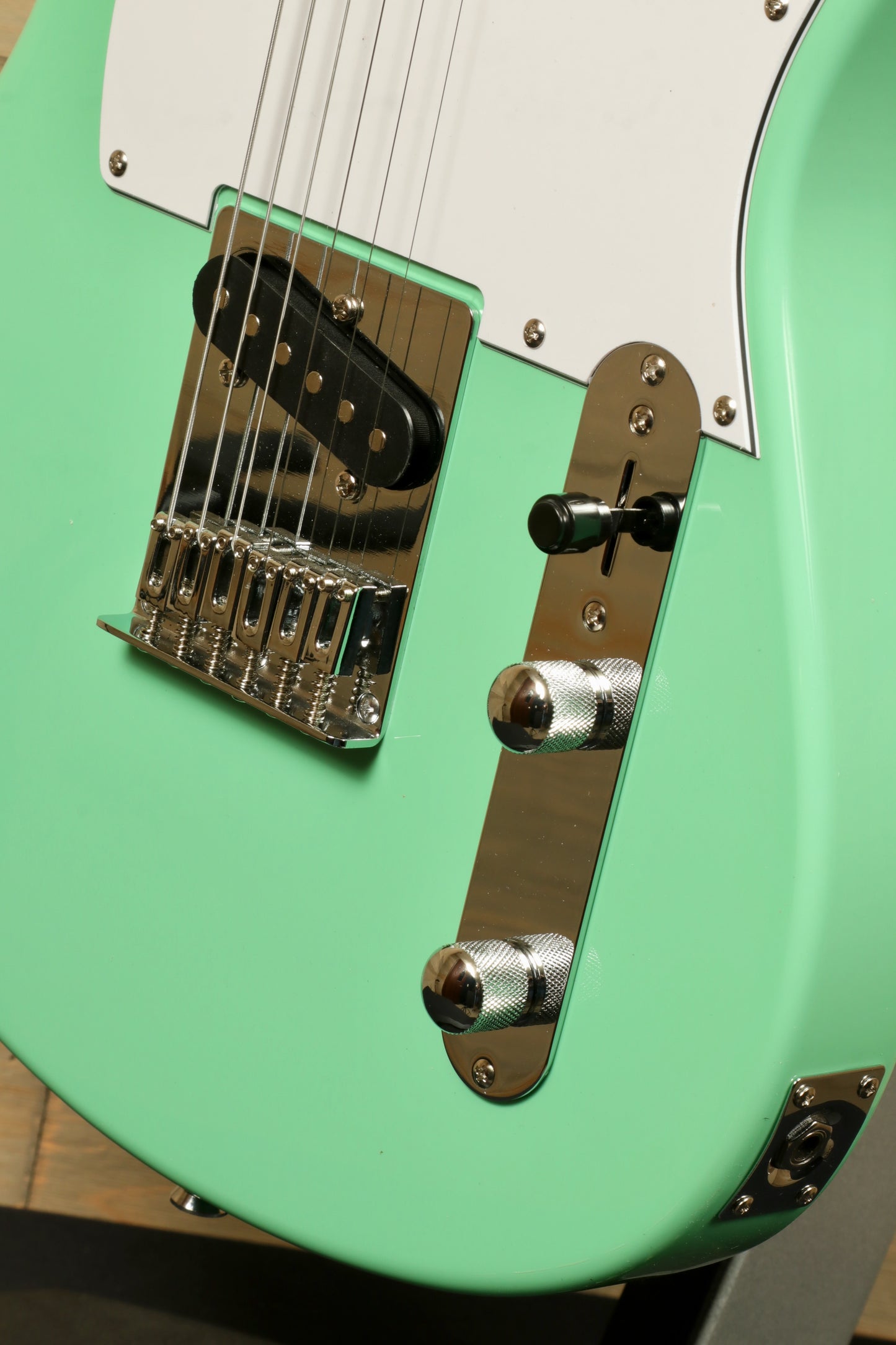 Tagima electric guitar guitars in mint green, close-up view of hardware and finish