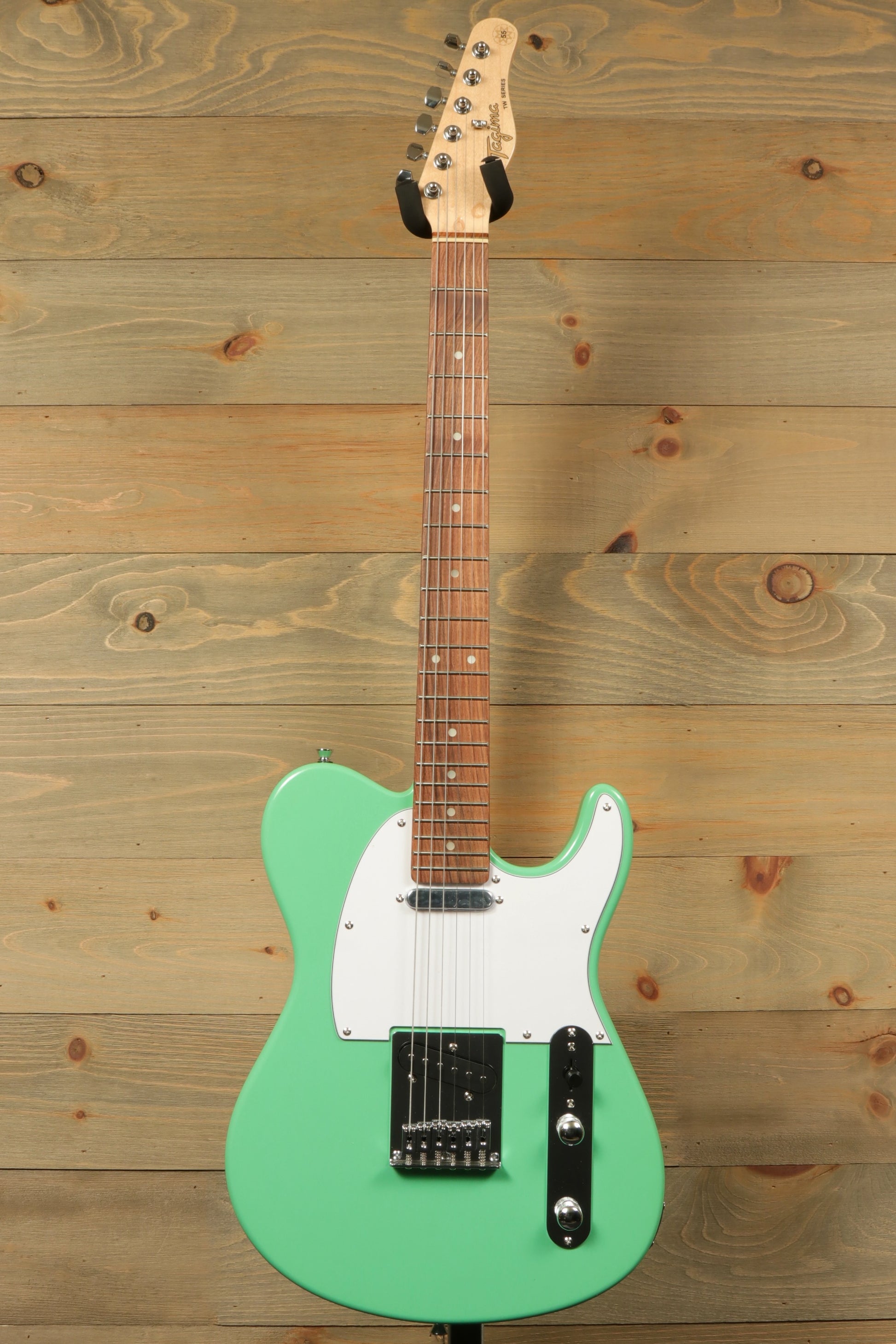 Tagima electric guitar in mint green with a maple neck, front view