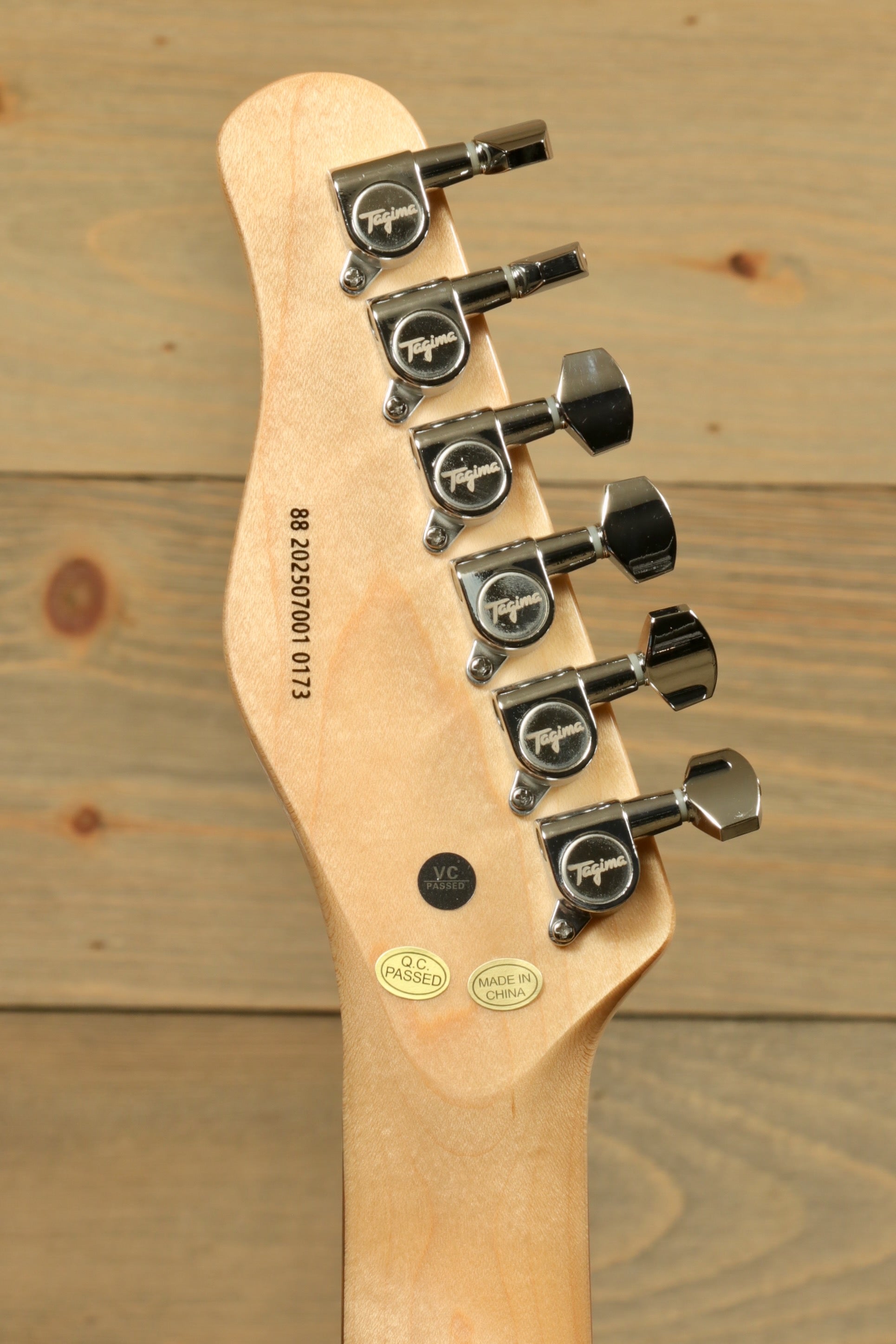 Tagima electric guitar guitars headstock with six tuning machines, natural wood finish, back view