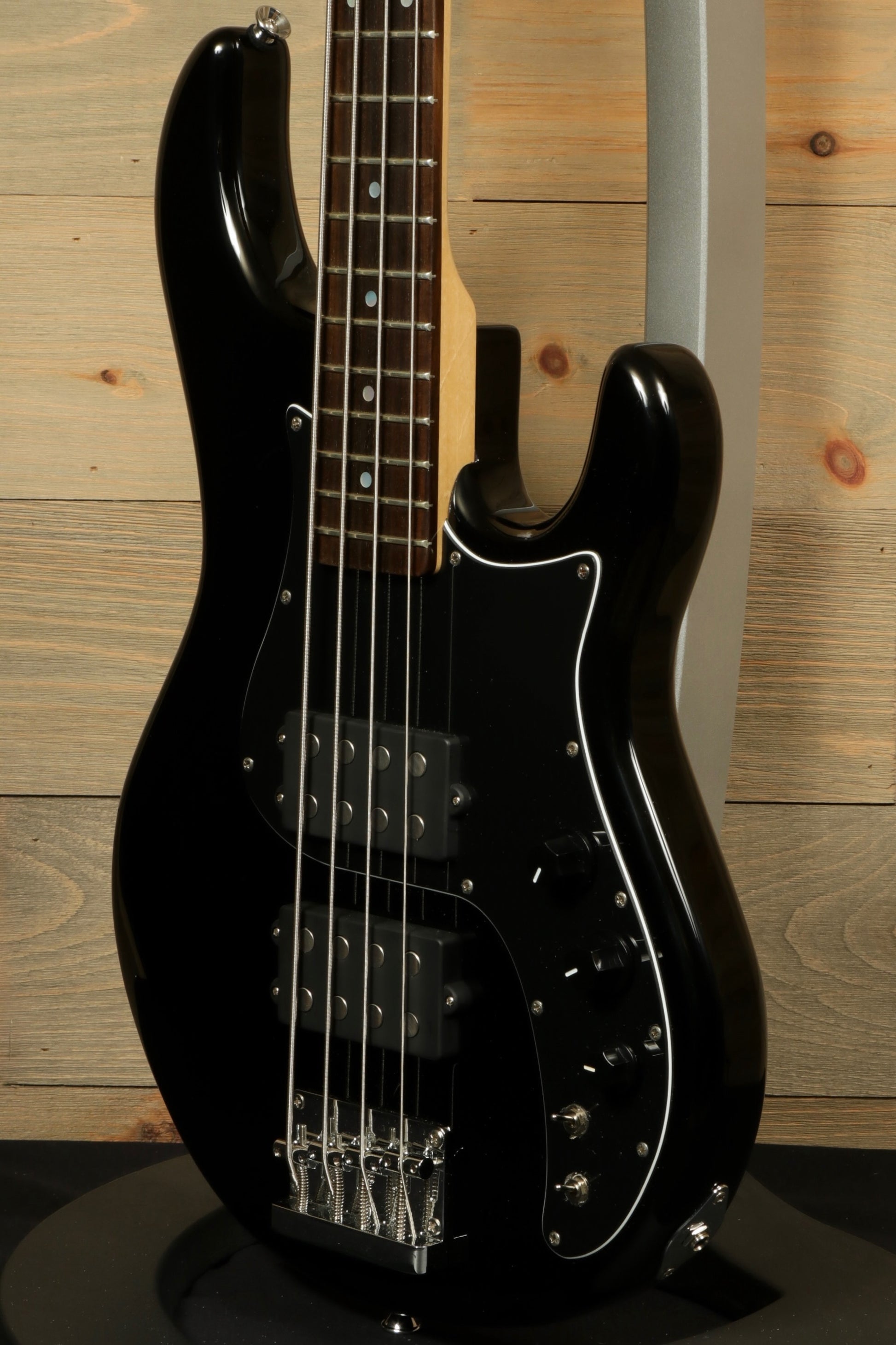 Tagima Fusion-4 H2 bass guitar in black with sleek design and double pickups for versatile sound