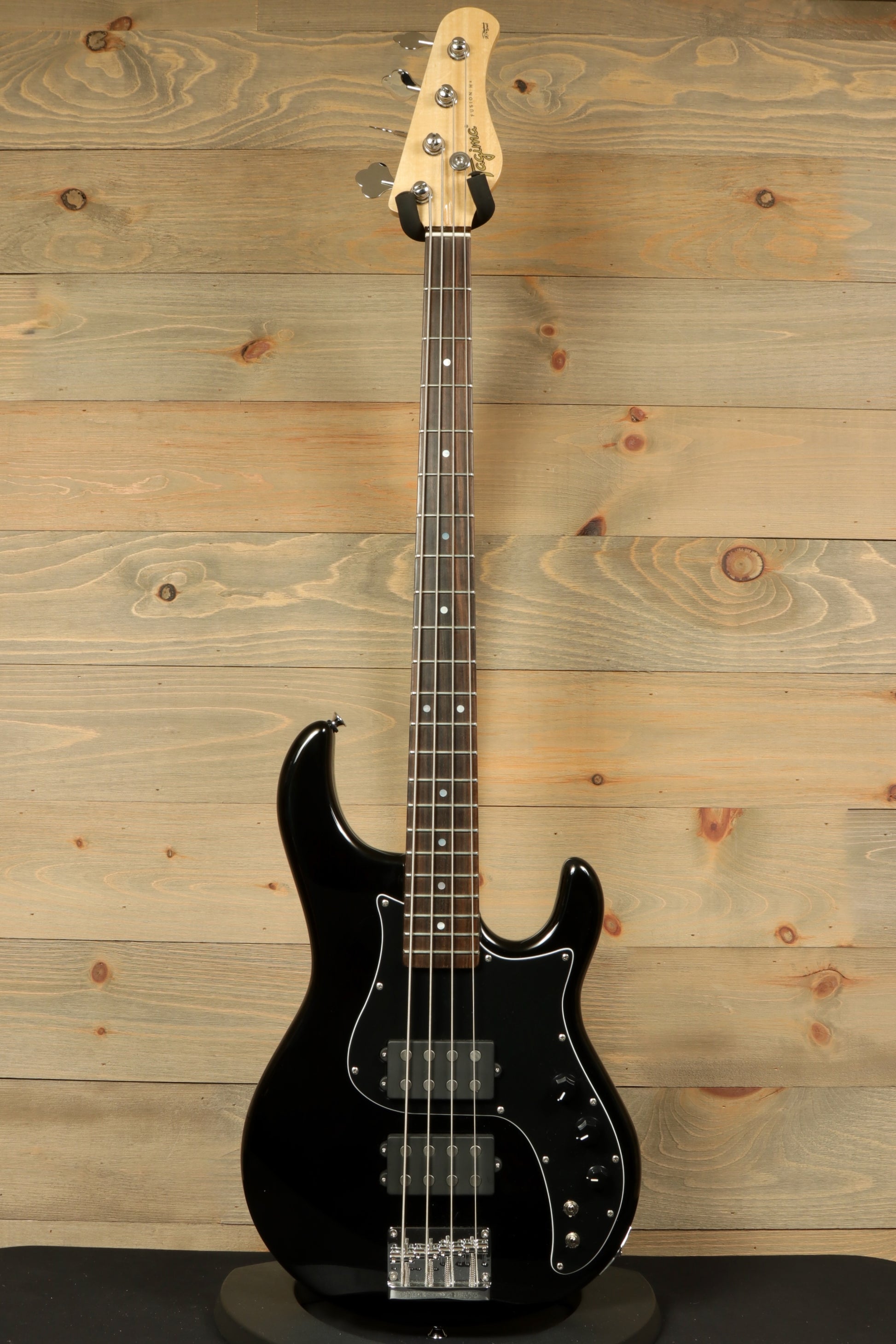 Tagima Fusion-4 H2 bass guitar in black finish with a sleek design and quality fretboard
