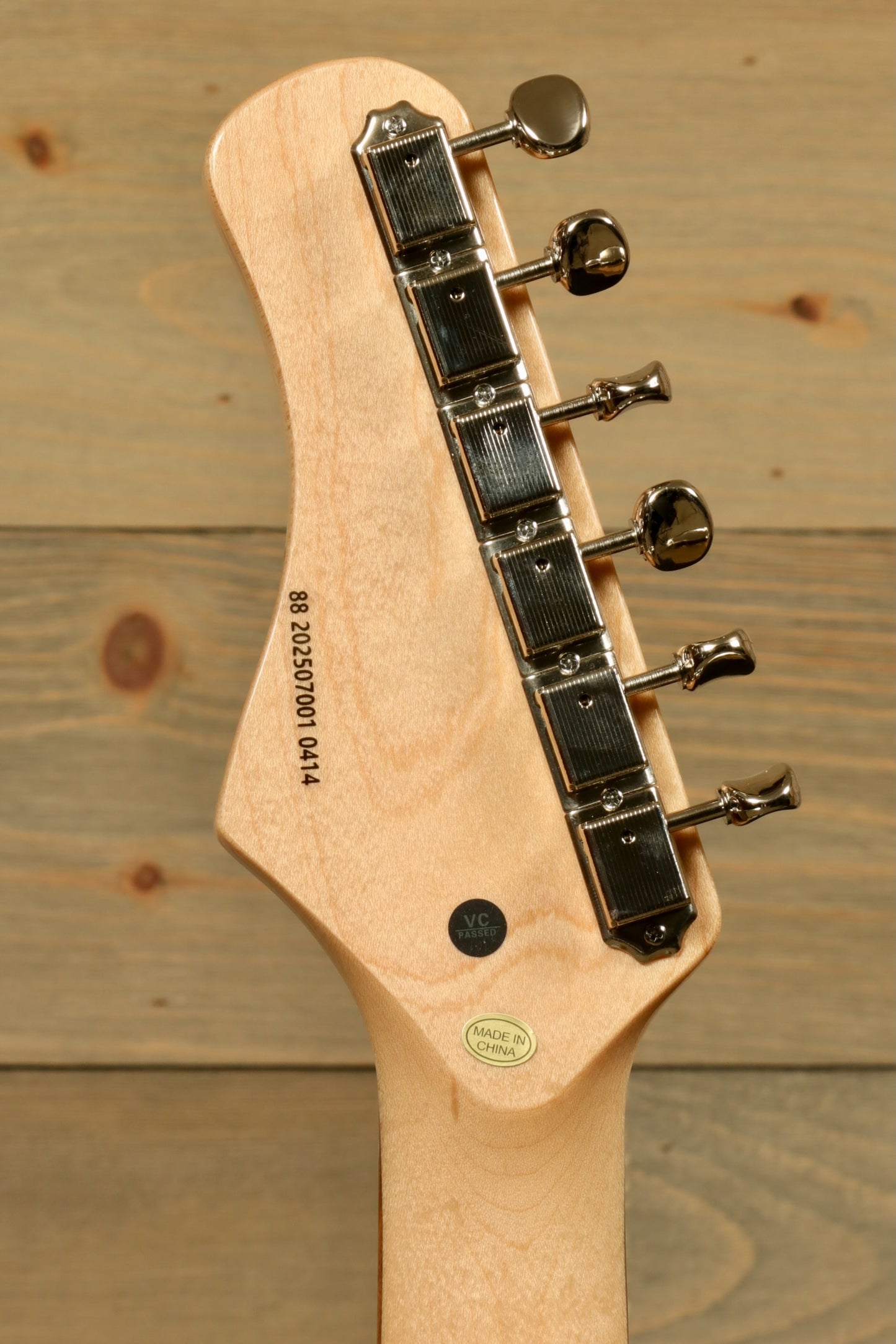 Tagima Jazz Electric Guitar headstock with chrome tuning pegs, natural wood finish, back view