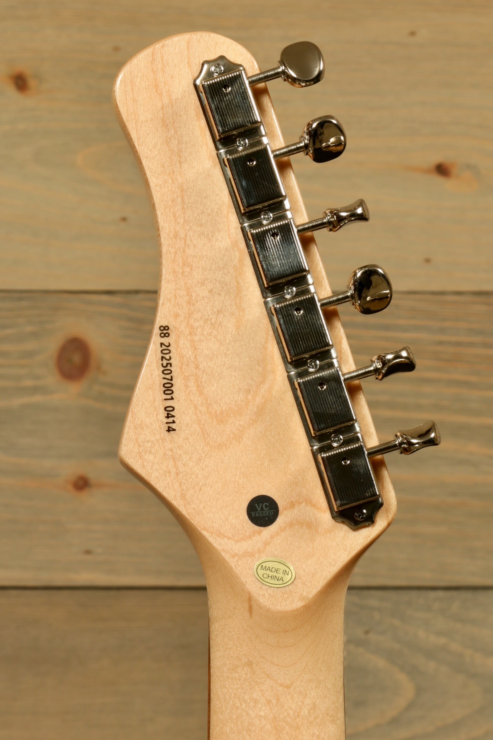 Tagima Jazz Electric Guitar headstock with chrome tuning pegs, natural wood finish, back view
