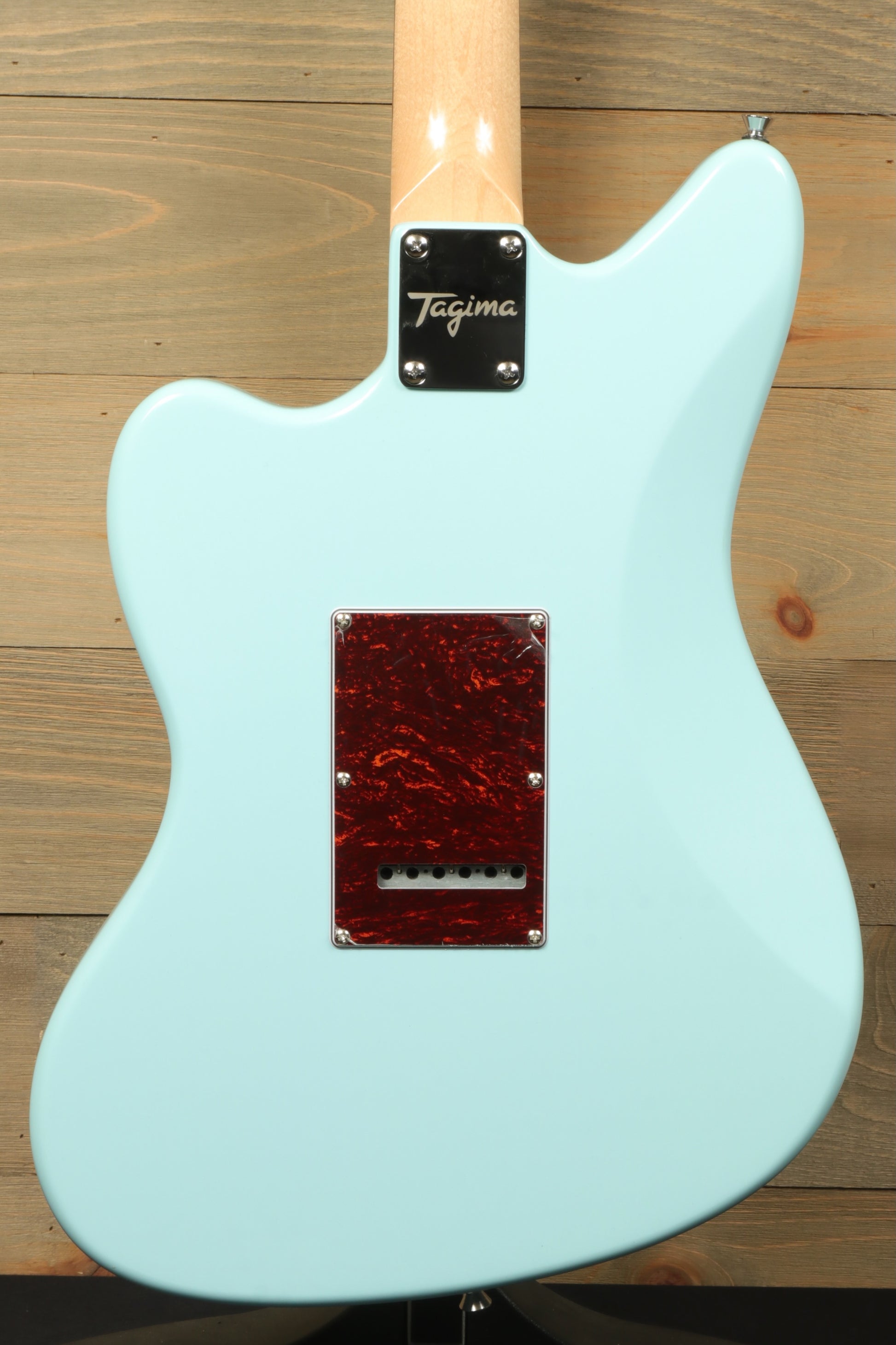 Tagima Jazz Electric Guitar in light blue, back view showcasing unique design and finish