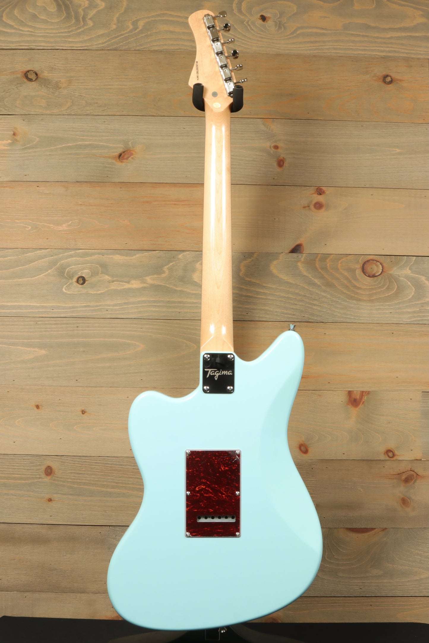 Tagima Jazz Electric Guitar in light blue, back view showcasing the smooth finish and sleek design