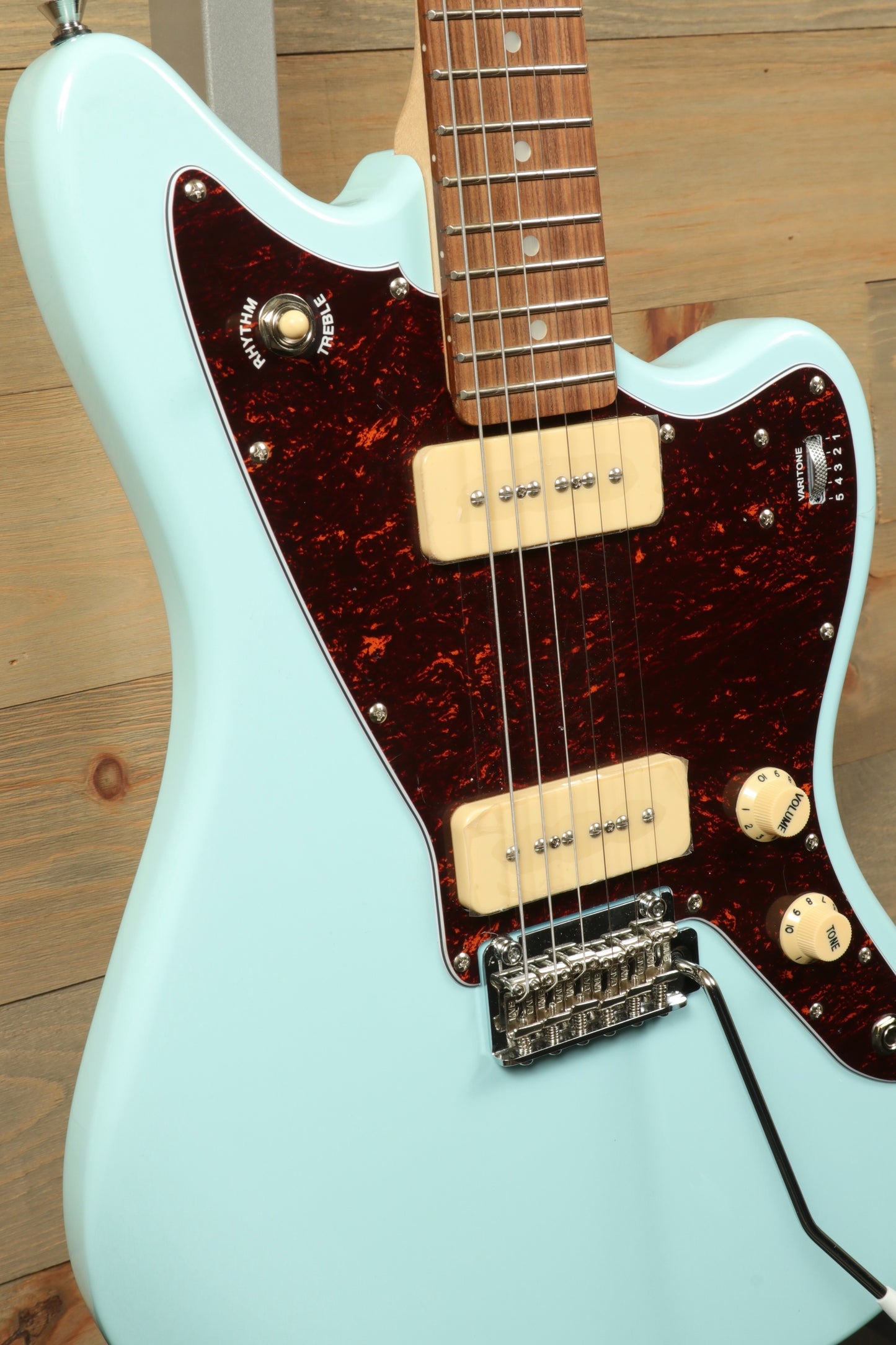 Tagima Jazz Electric Guitar in pastel blue finish, angled front view showcasing pickups and controls