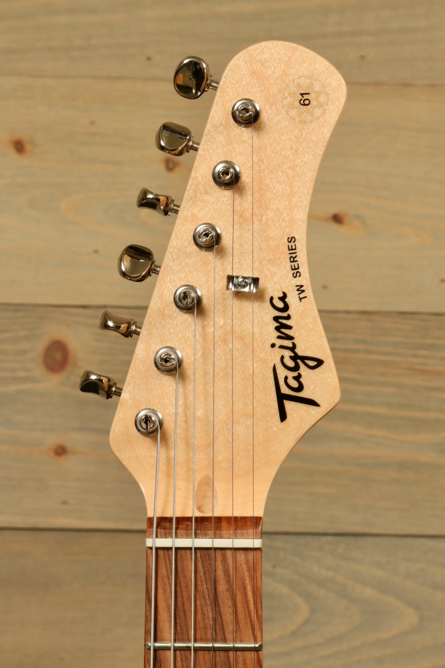Tagima Jazz Electric Guitar, natural wood finish, headstock view showcasing tuning pegs