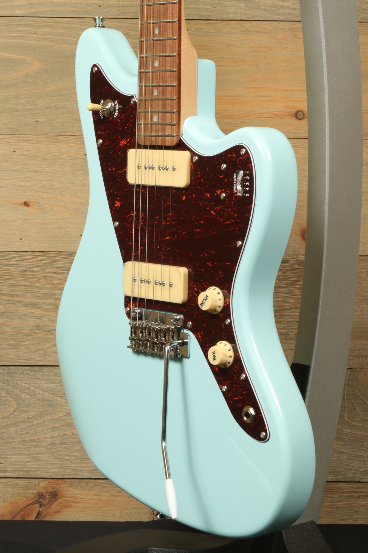 Tagima Jazz Electric Guitar in ice blue with a brown tortoiseshell pickguard, side view