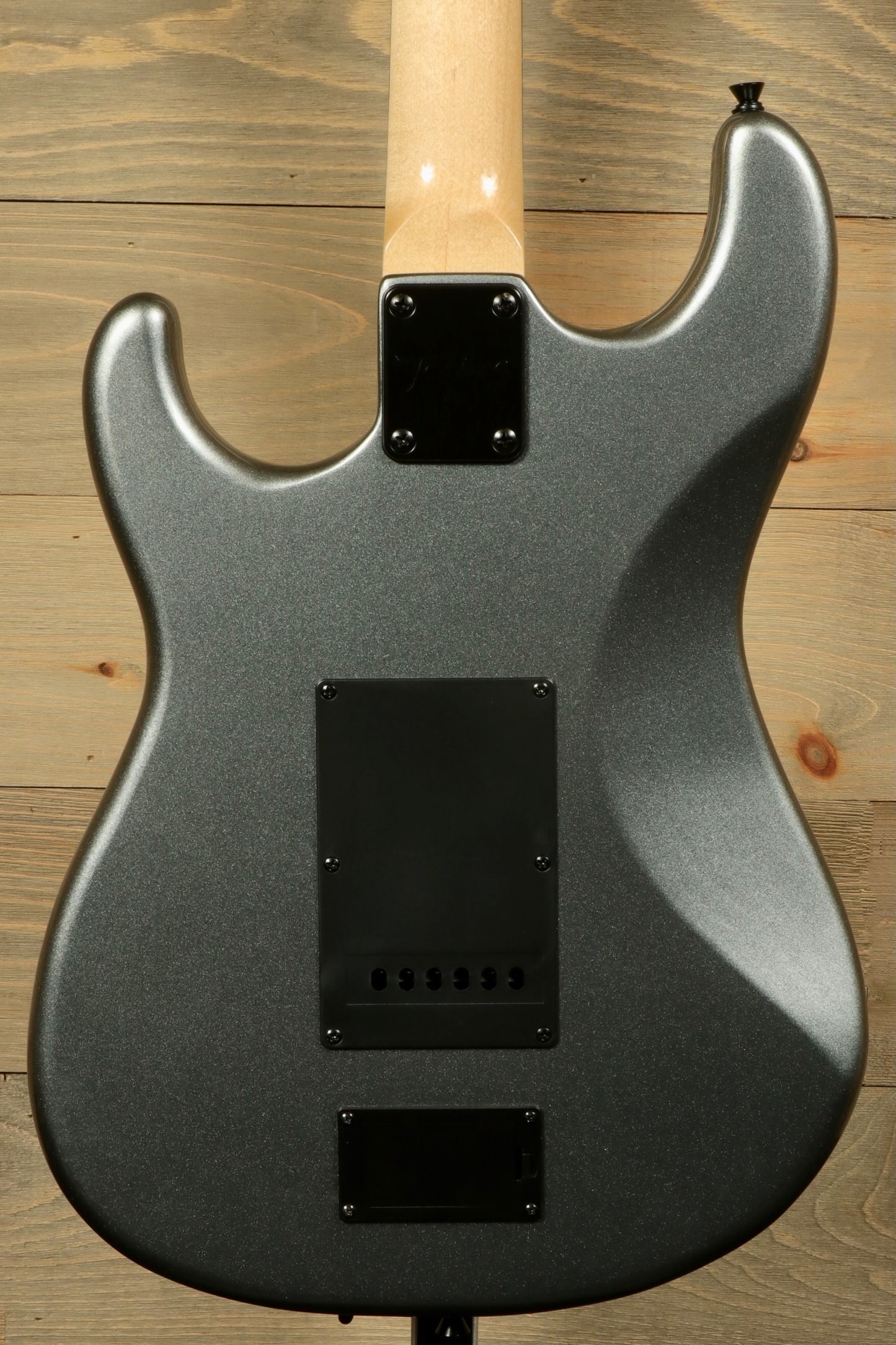 Back view of Tagima Sixmart electric guitar featuring a sleek gray finish and smooth contours