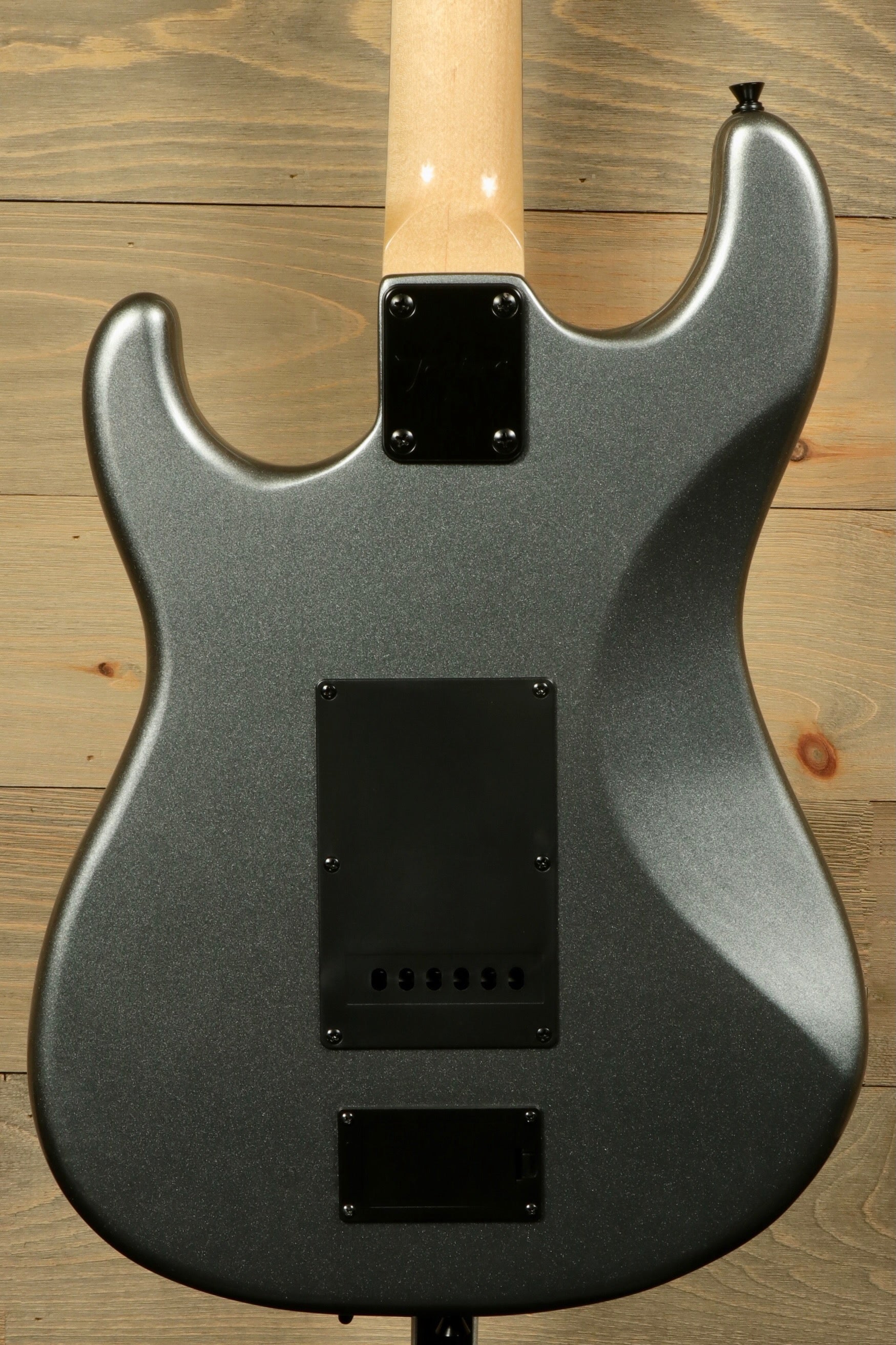 Back view of Tagima Sixmart electric guitar featuring a sleek gray finish and smooth contours