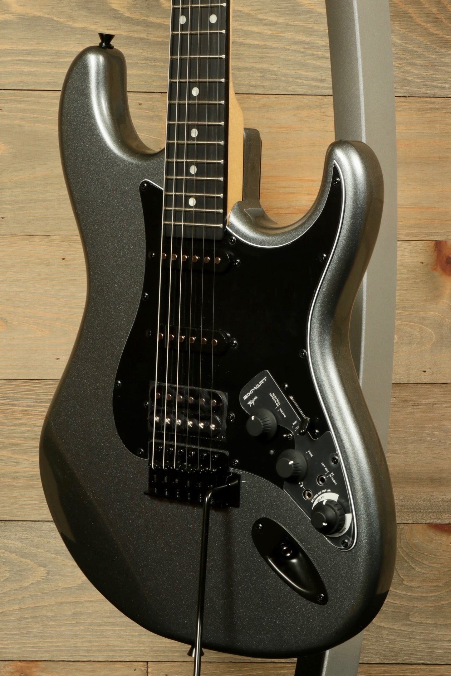 Tagima Sixmart electric guitar in metallic gray with sleek design and versatile controls