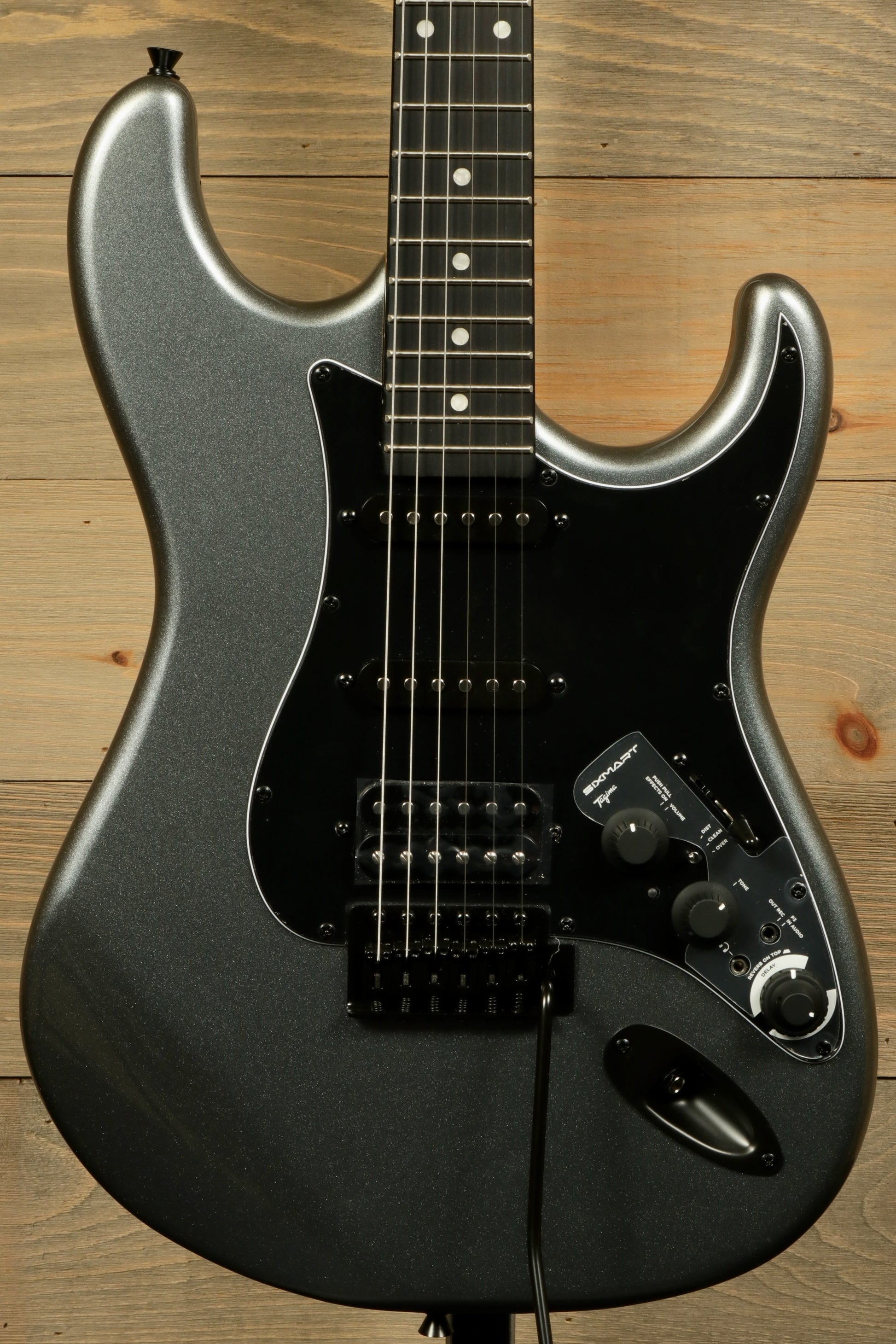 Tagima Sixmart electric guitar in metallic gray with sleek design and versatile controls
