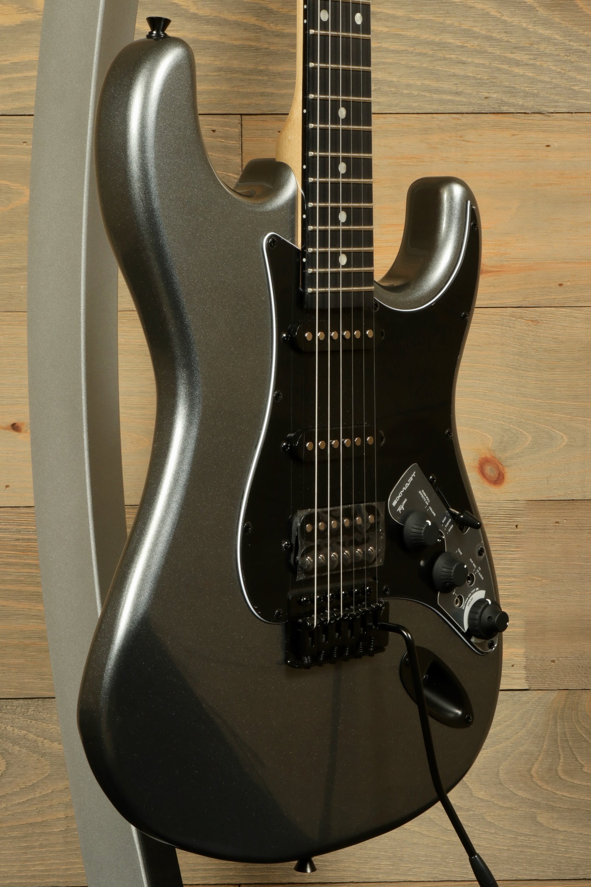 Tagima Sixmart electric guitar in metallic gray finish with black pickguard and chrome hardware