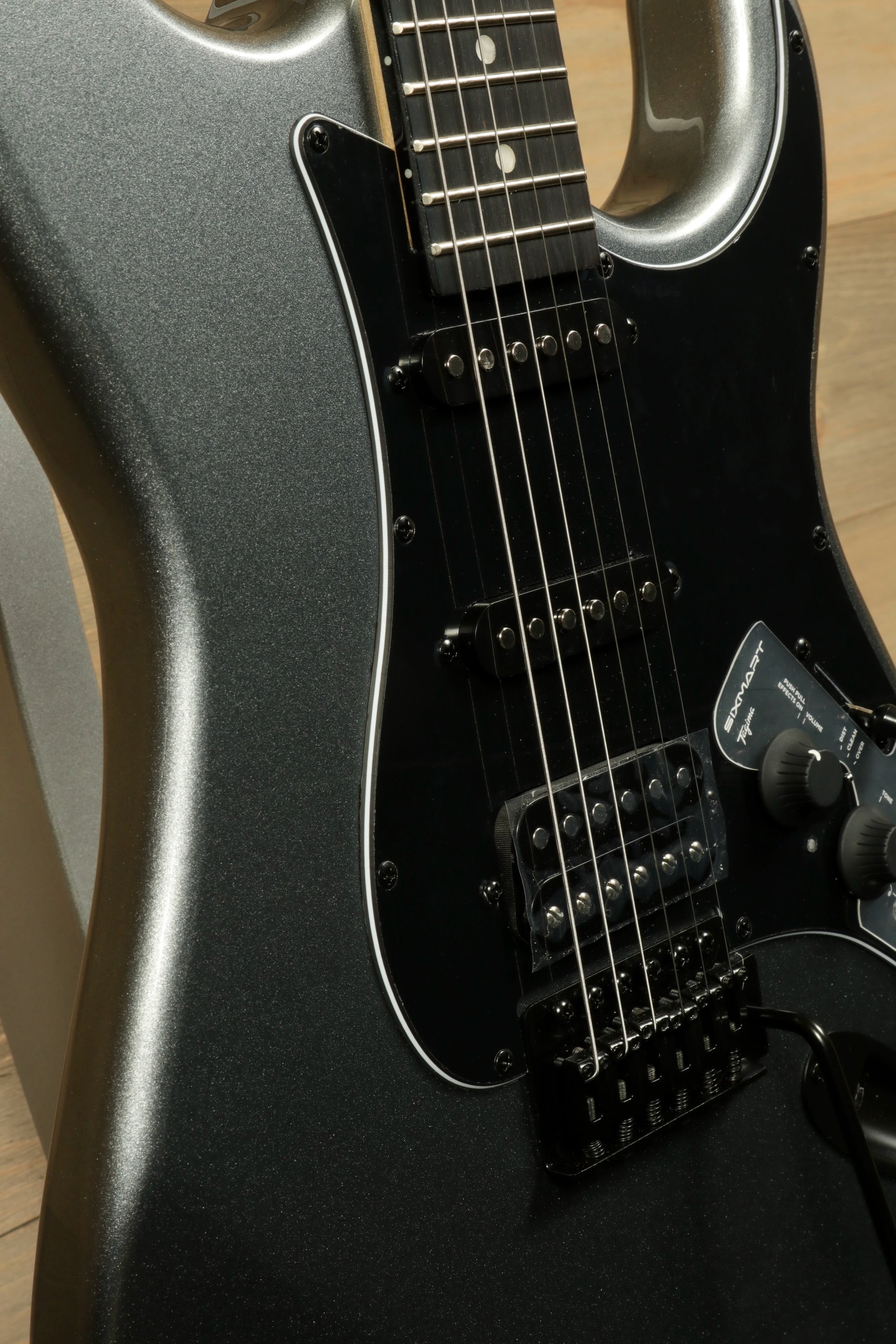 Tagima Sixmart electric guitar in sleek black finish showcasing detailed body and neck design
