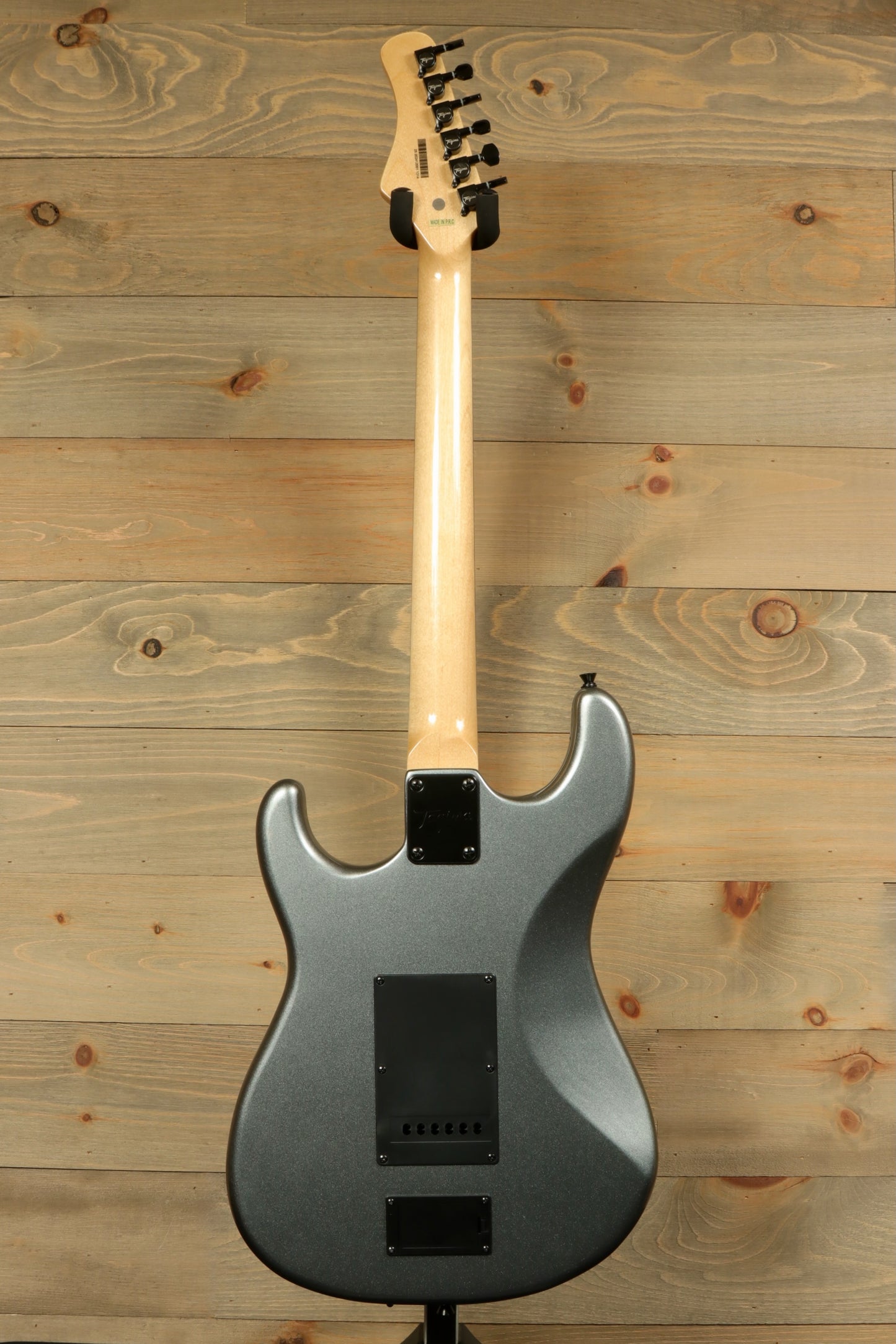 Back view of Tagima Sixmart electric guitar in sleek gray finish with a smooth body design