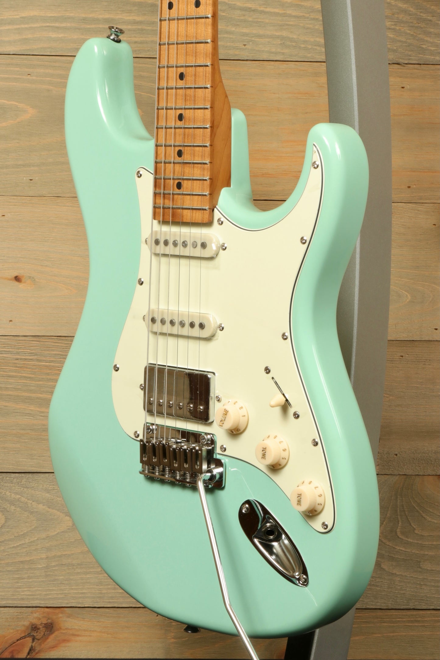 Tagima T 640 SUPER electric guitar in mint green, front view showcasing body and hardware