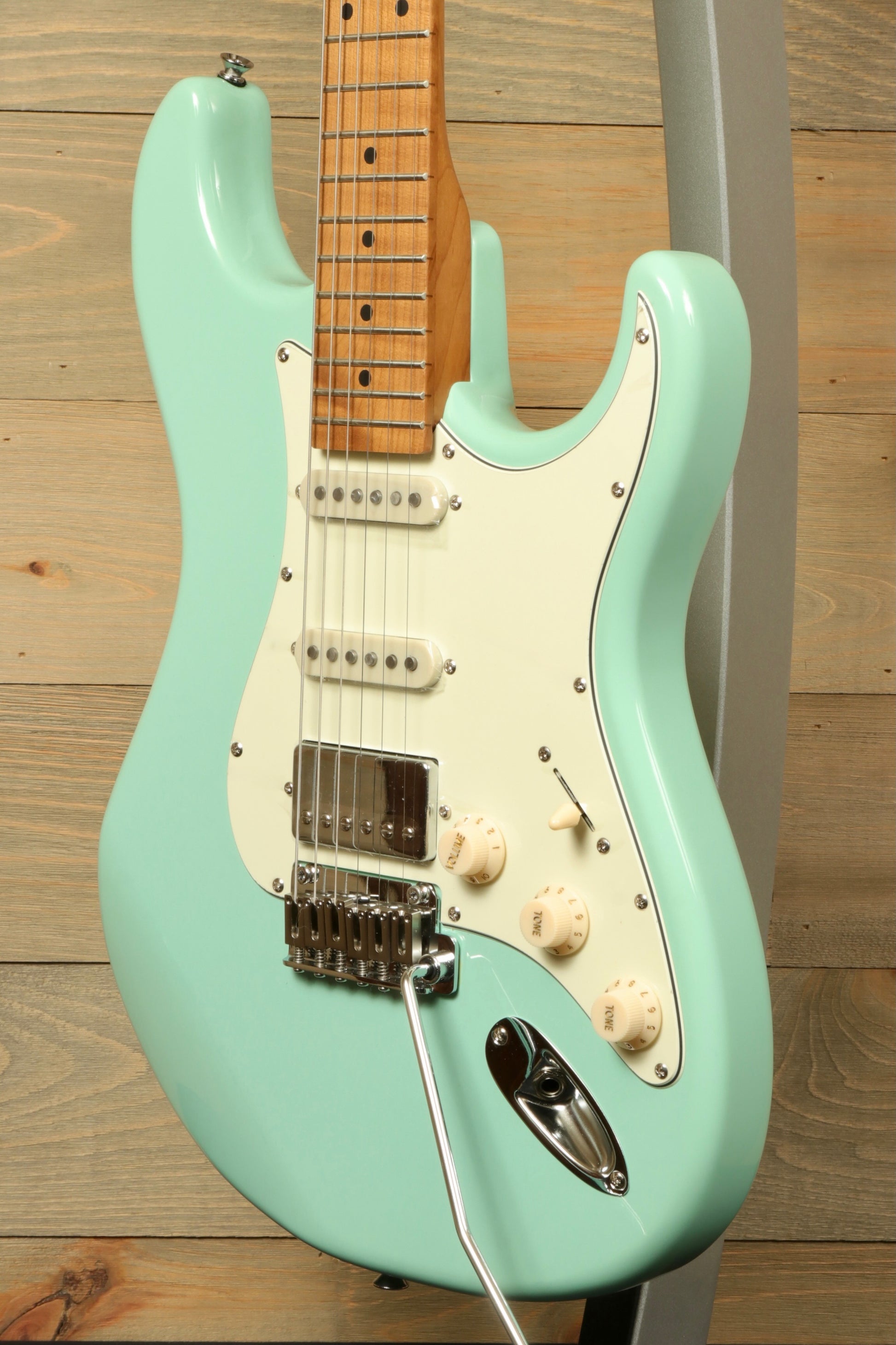Tagima T 640 SUPER electric guitar in mint green, front view showcasing body and hardware