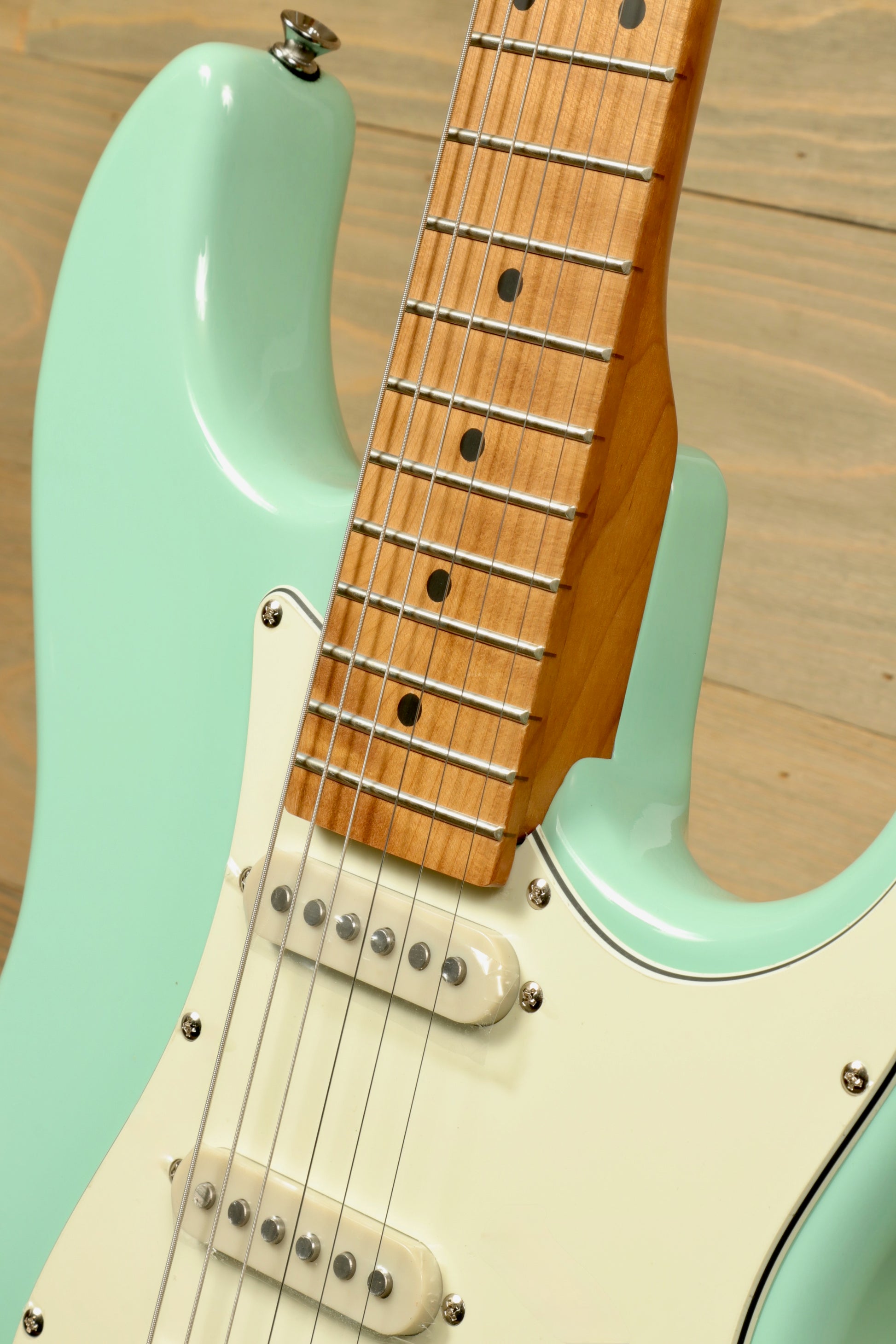 Tagima T 640 SUPER mint green electric guitar with maple neck, front view showcasing the fretboard