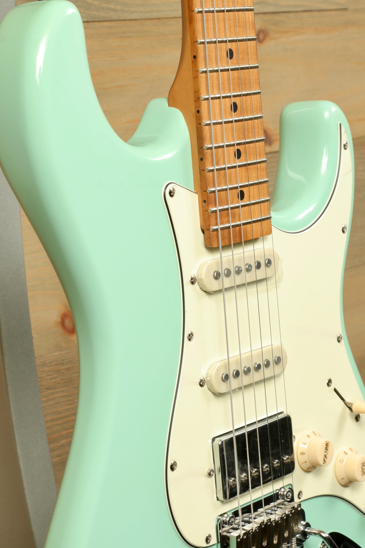 Tagima T 640 SUPER electric guitar in mint green with a classic design, front view showcasing the fretboard