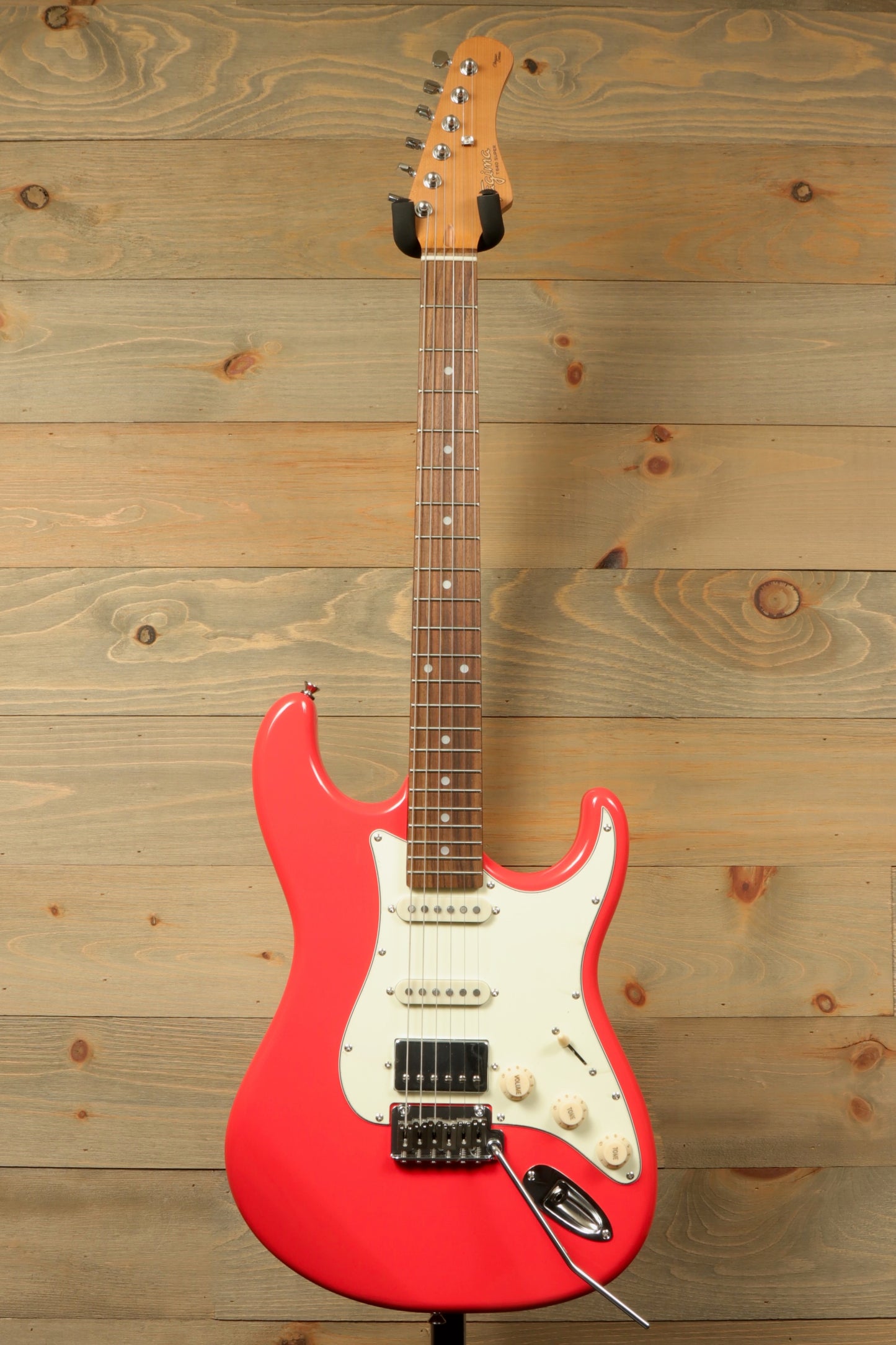 Tagima T 640 SUPER electric guitar in bright pink, front view with rosewood fretboard