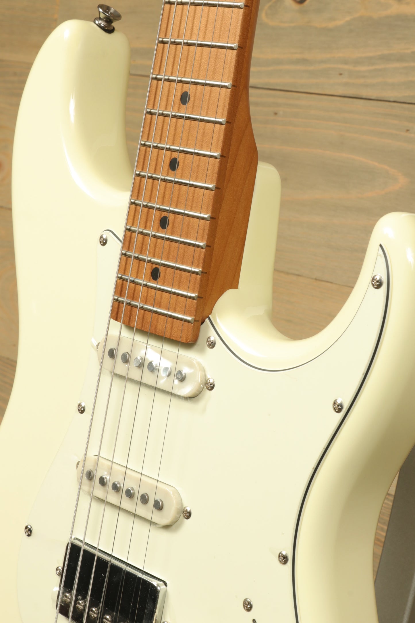Tagima T 640 SUPER electric guitar in white, close-up view showing neck and pickups