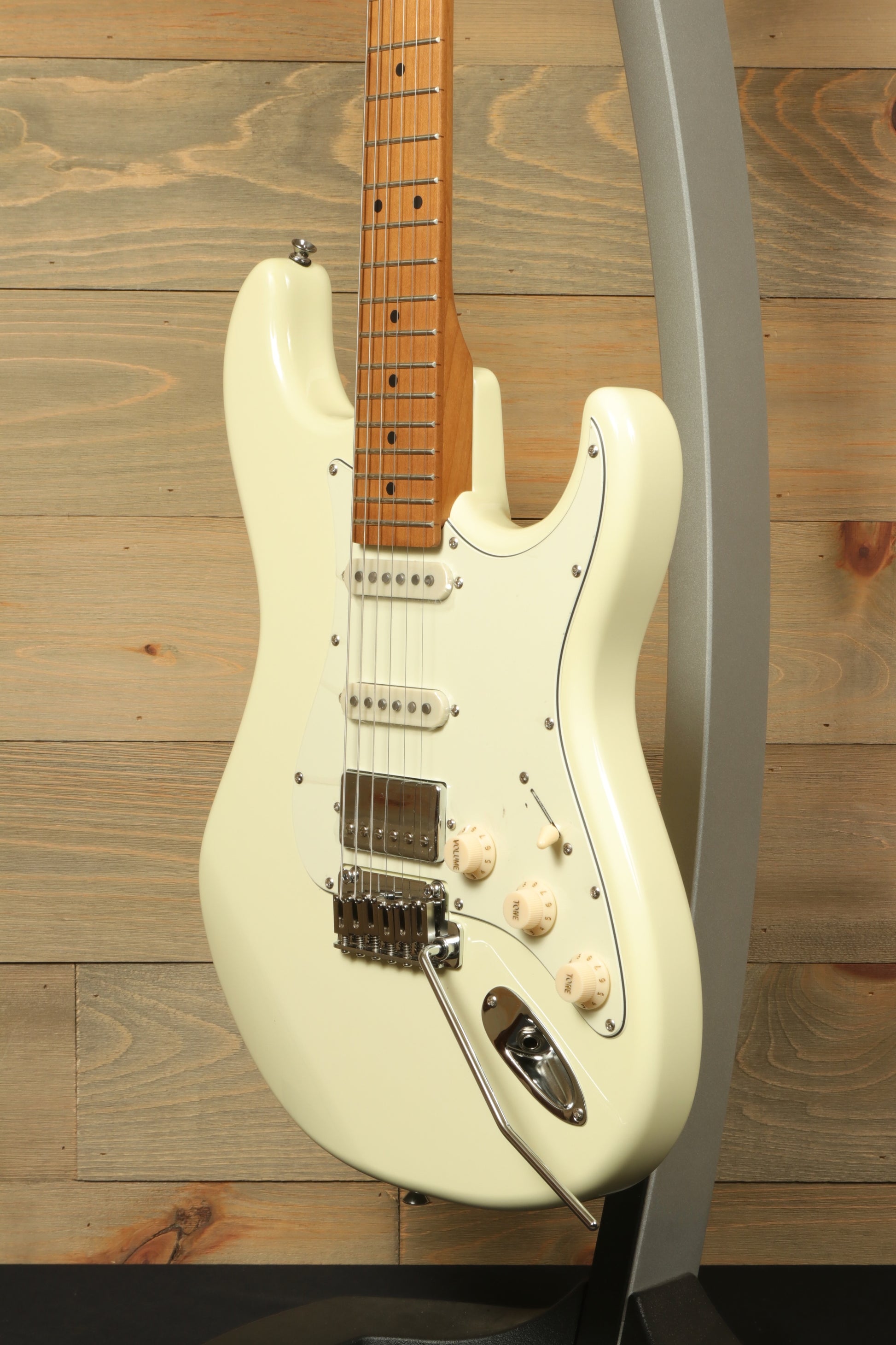 Tagima T 640 SUPER electric guitar in creamy white, side view with a sleek design